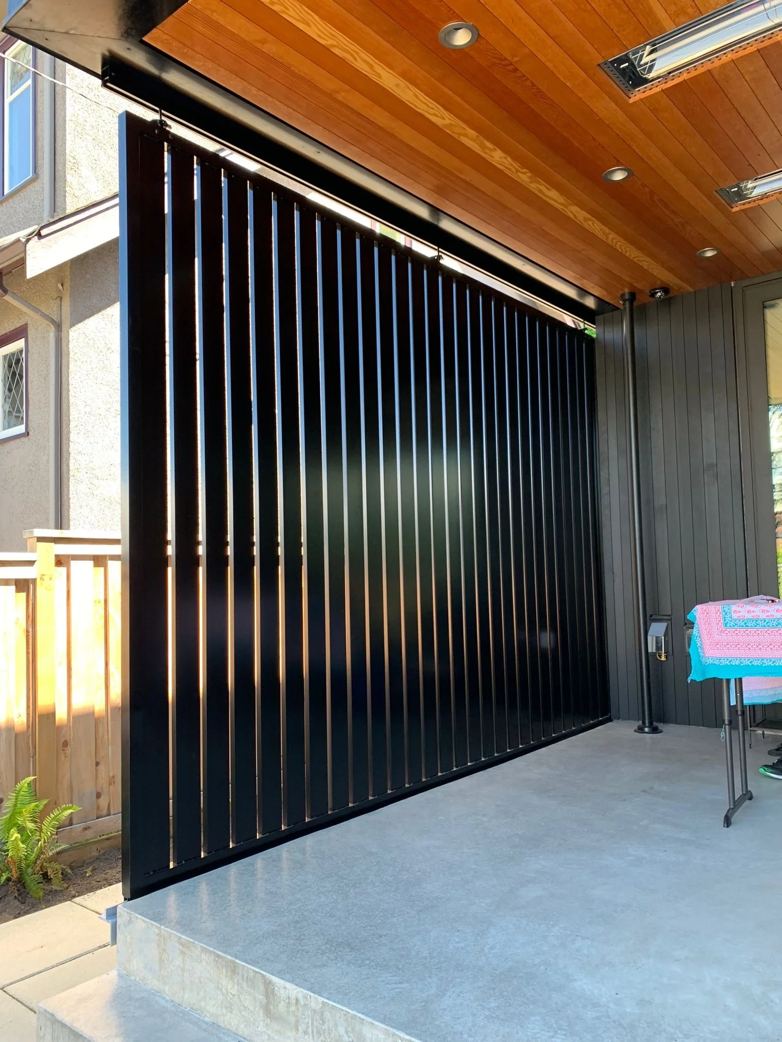 Vertical metal screen system Vancouver residential design