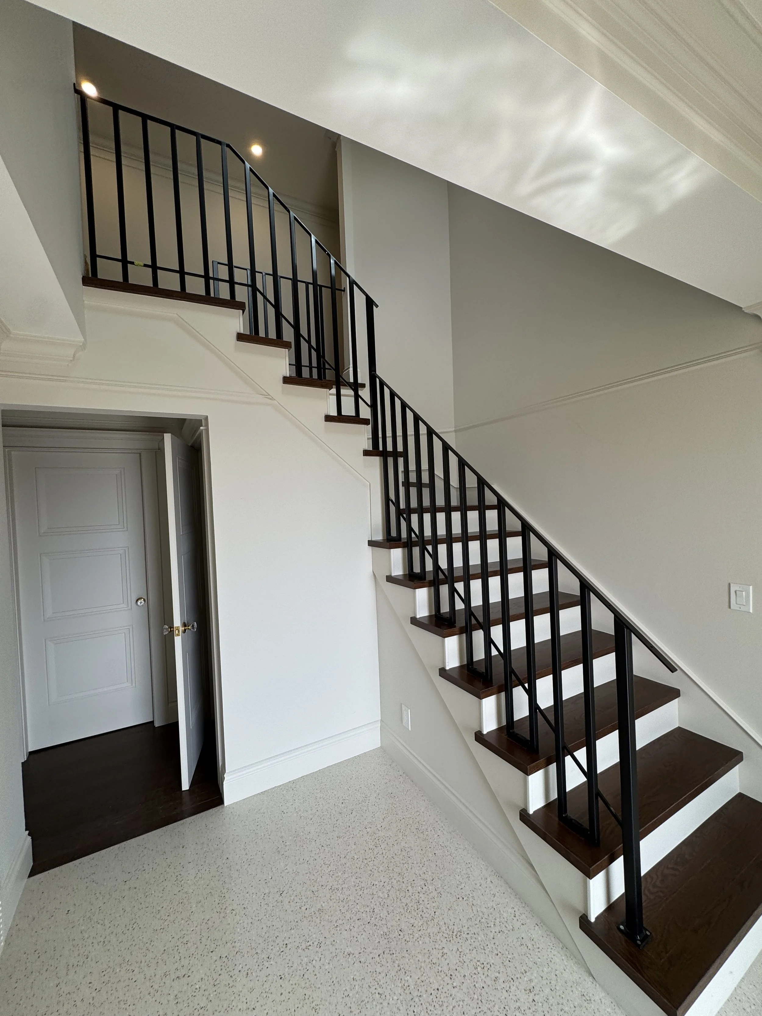 Modern interior  custom metal railing designed and fabricated by Iron Age Manufacturing Ltd. in Vancouver.
