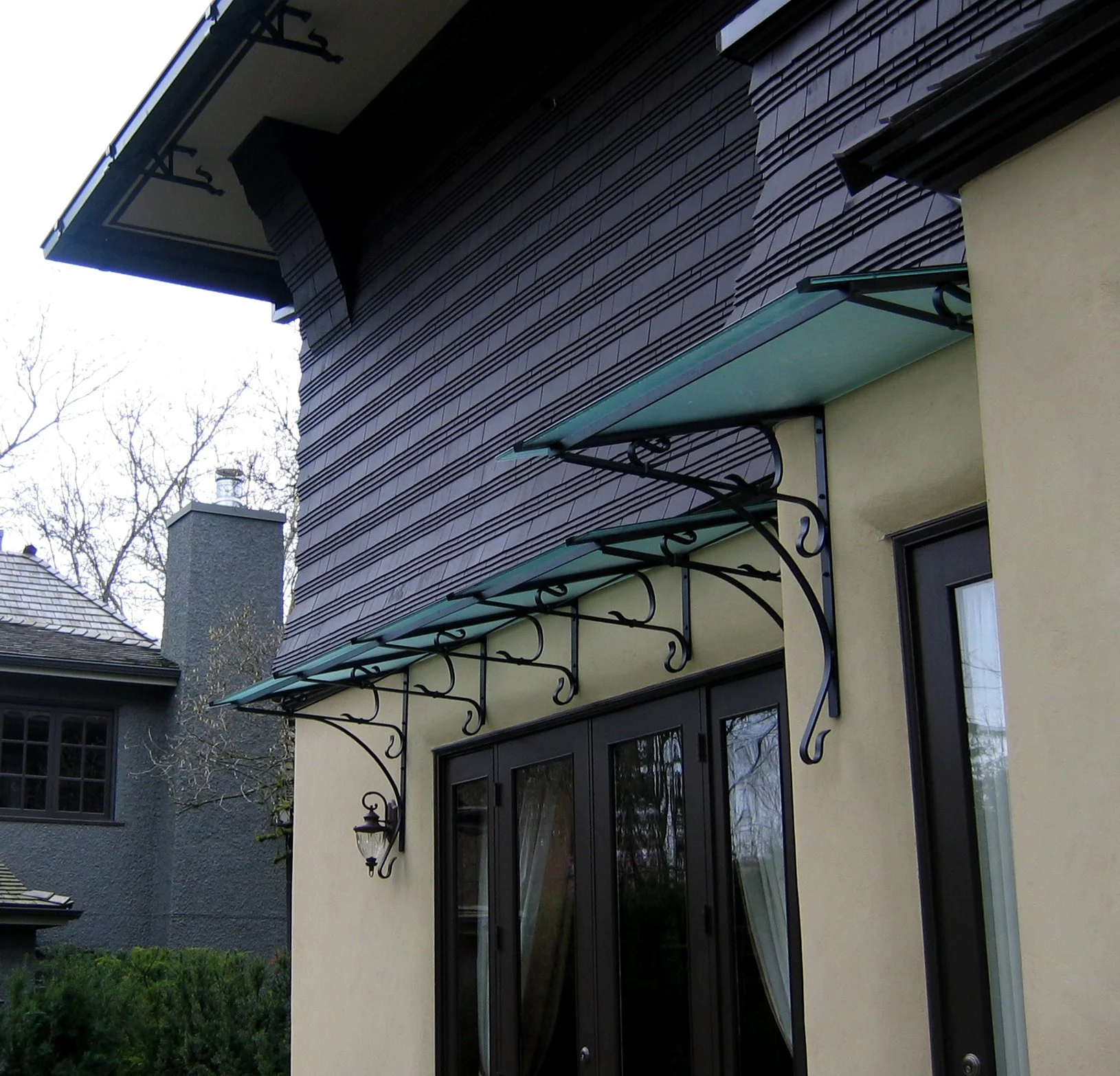 Glass canopy over patio Vancouver modern design 1