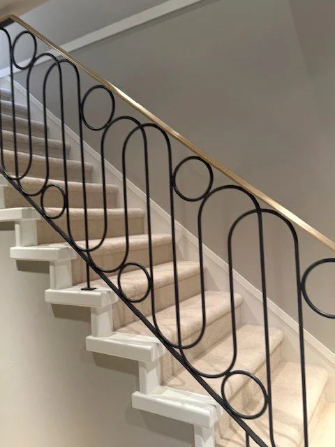 Straight line black metal railing for staircase Vancouver