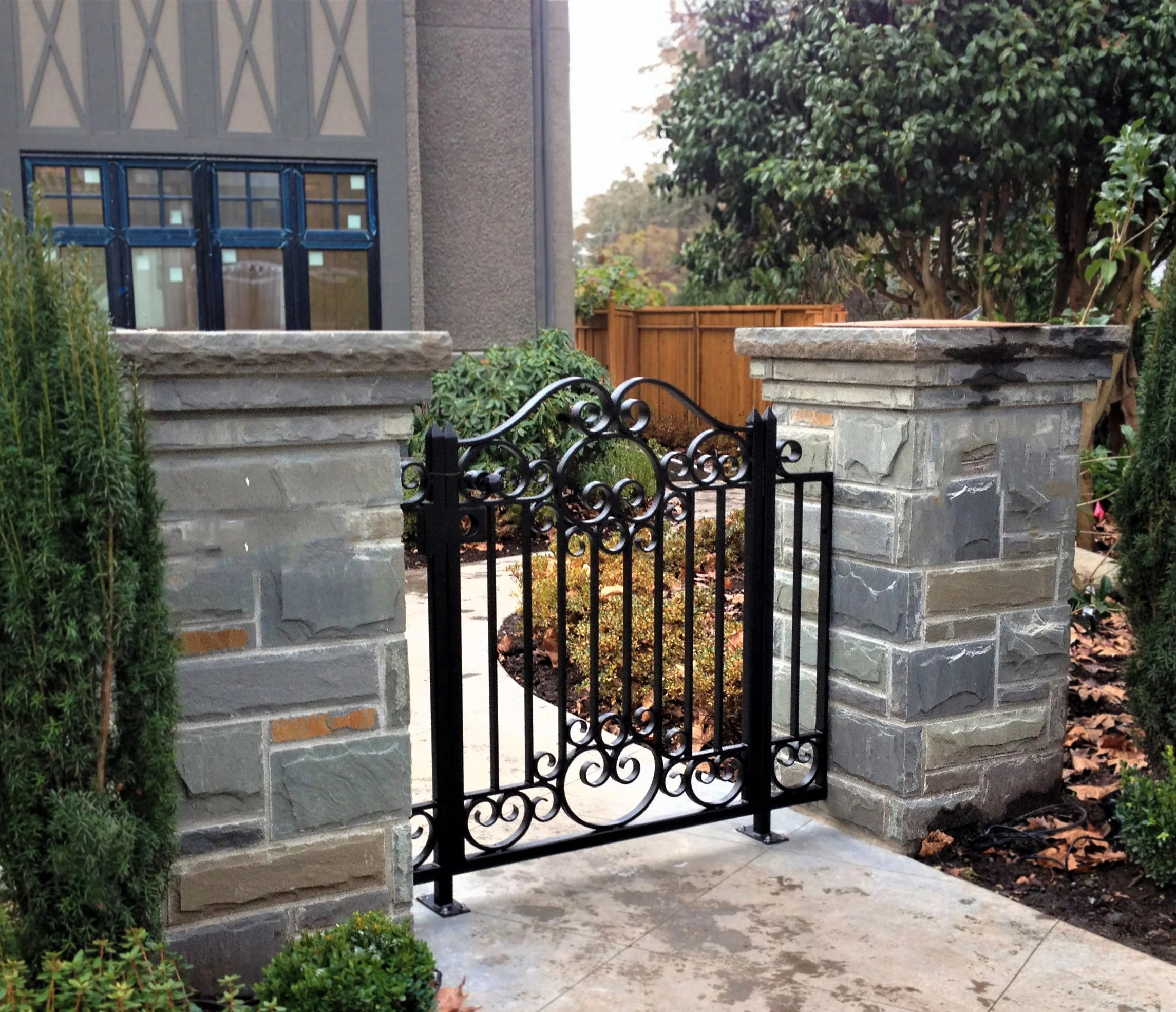 Custom iron pedestrian gate with clean lines and modern appeal, fabricated in Vancouver 18