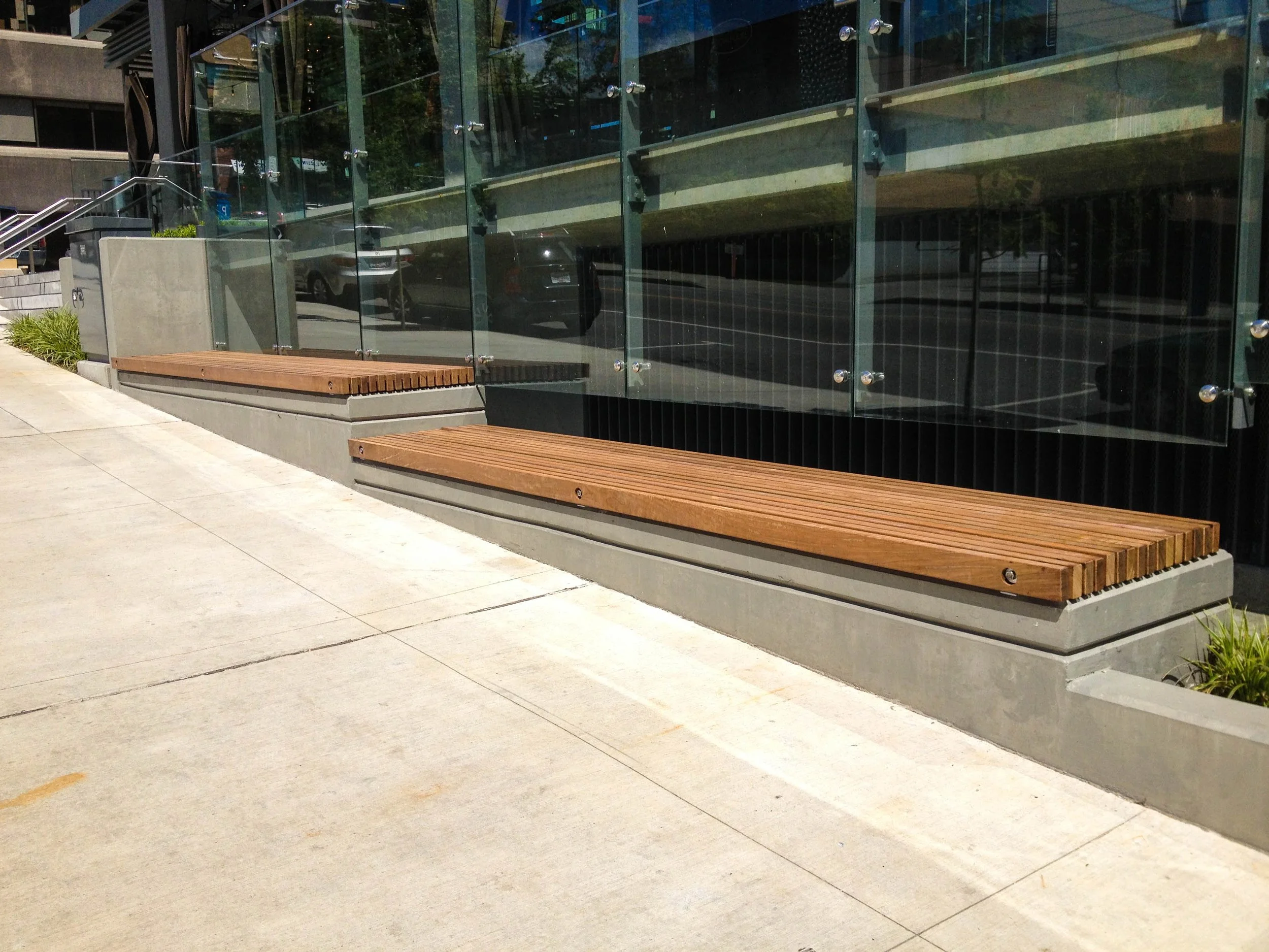 Custom outdoor bench integrated with architecture Vancouver