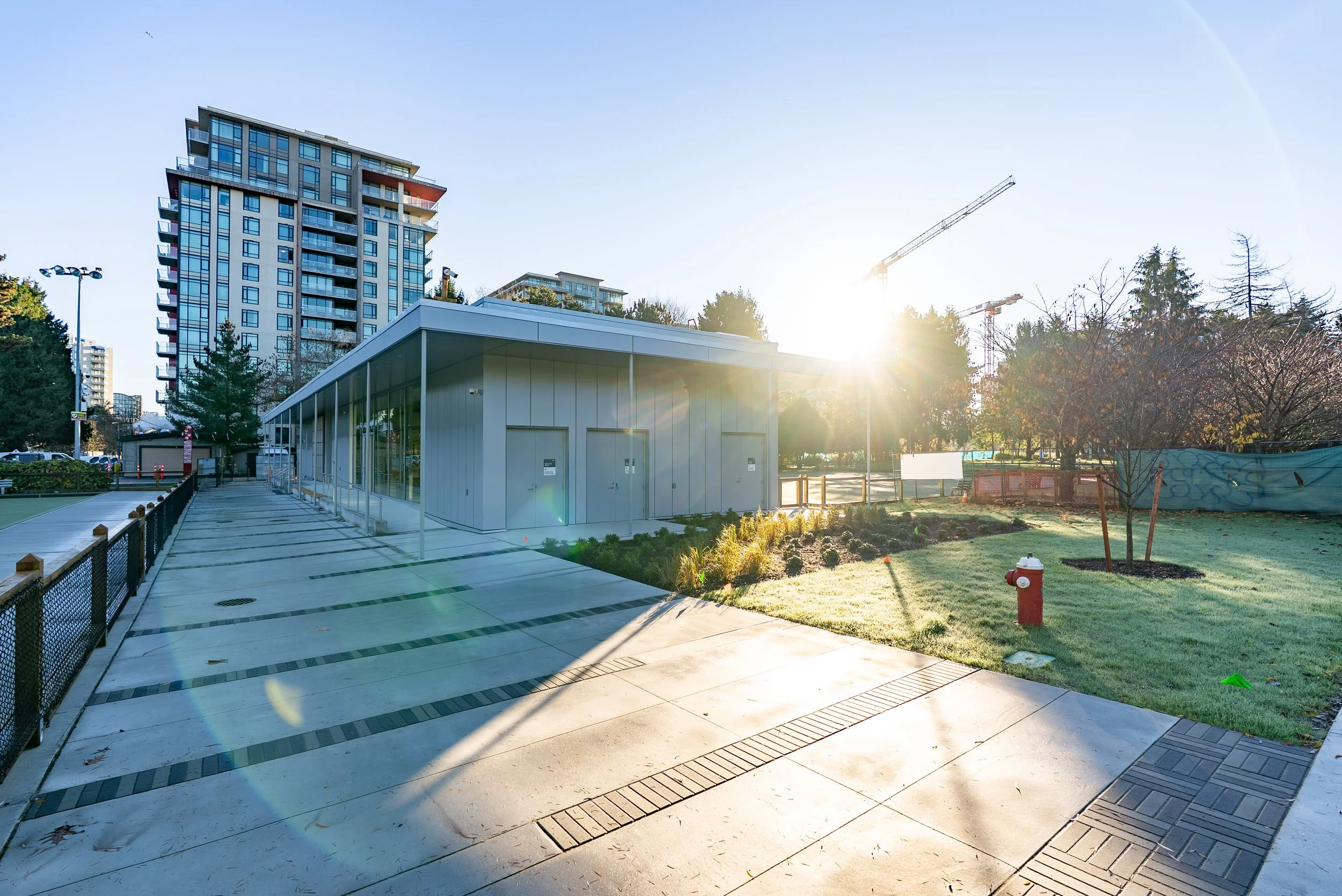 Modern community centre exterior with custom stainless steel handrails and metal fabrication by Iron Age Manufacturing, Richmond BC.