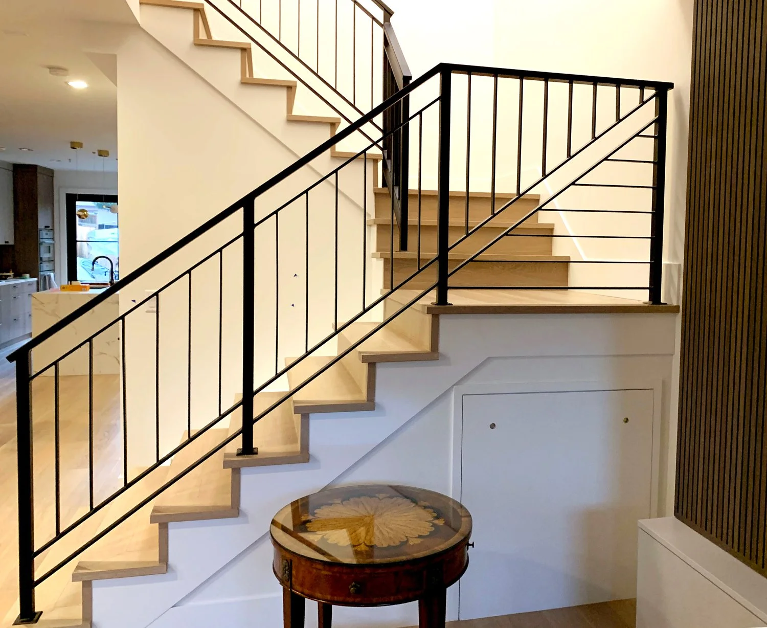 Straight line black metal railing for staircase Vancouver
