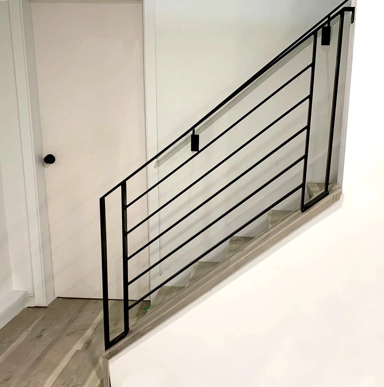 Modern staircase railing in matte black finish Vancouver