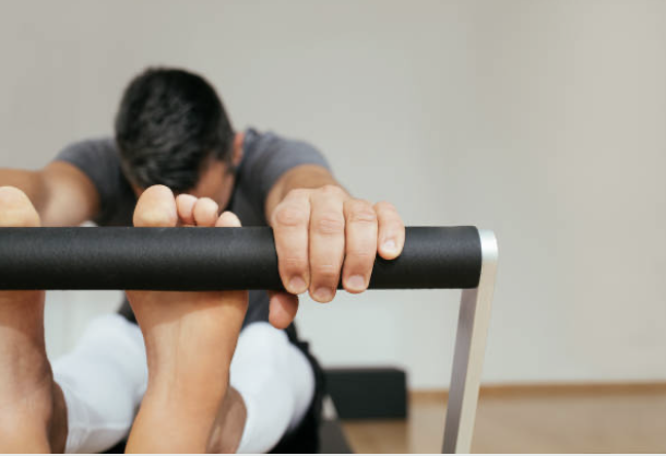 Man Reformer Stretch PIlates.png