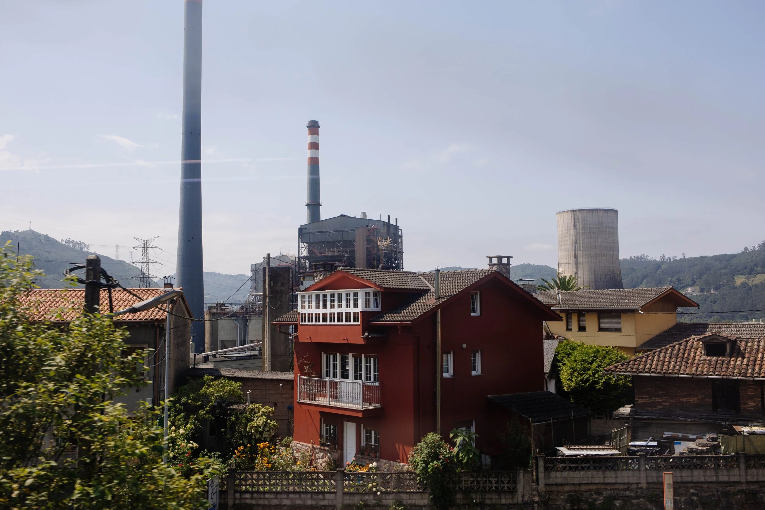  Industrial town with smokestacks and cooling tower. 