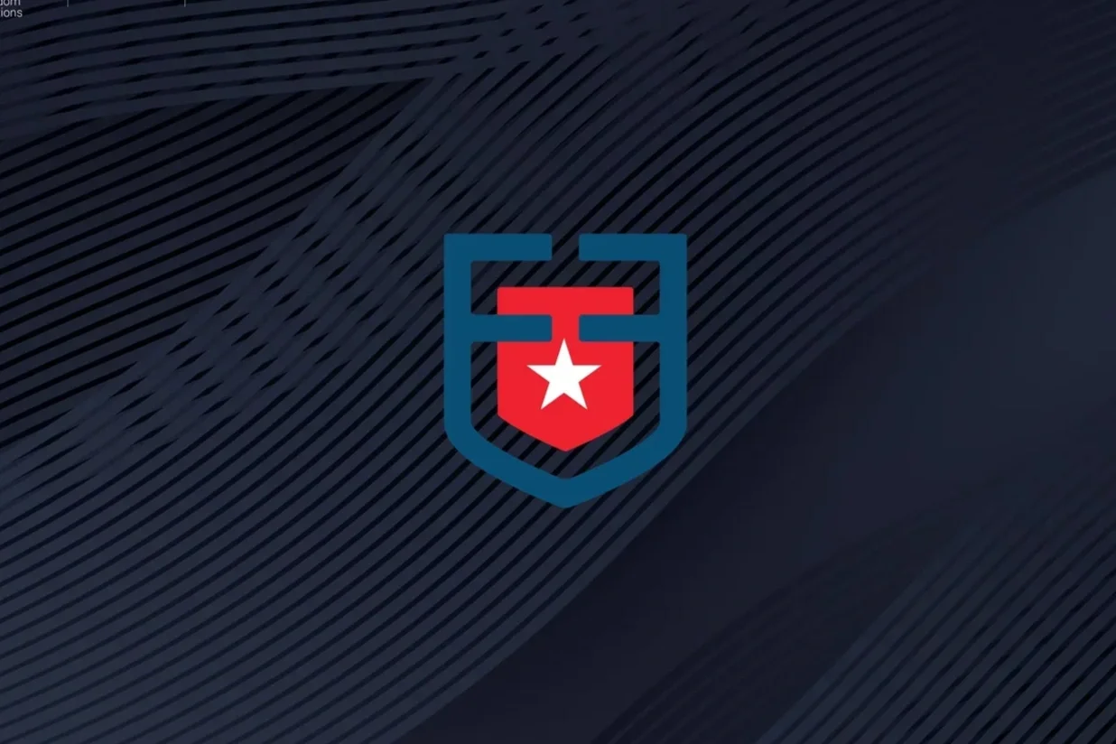 two navy, capital Fs facing each other, connected at the descender with a red shield in the center with a white star