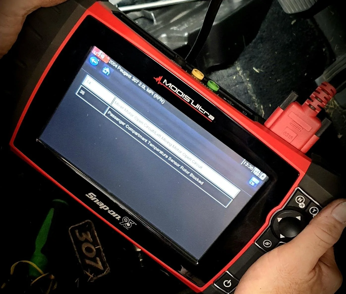 Car engine being diagnosed