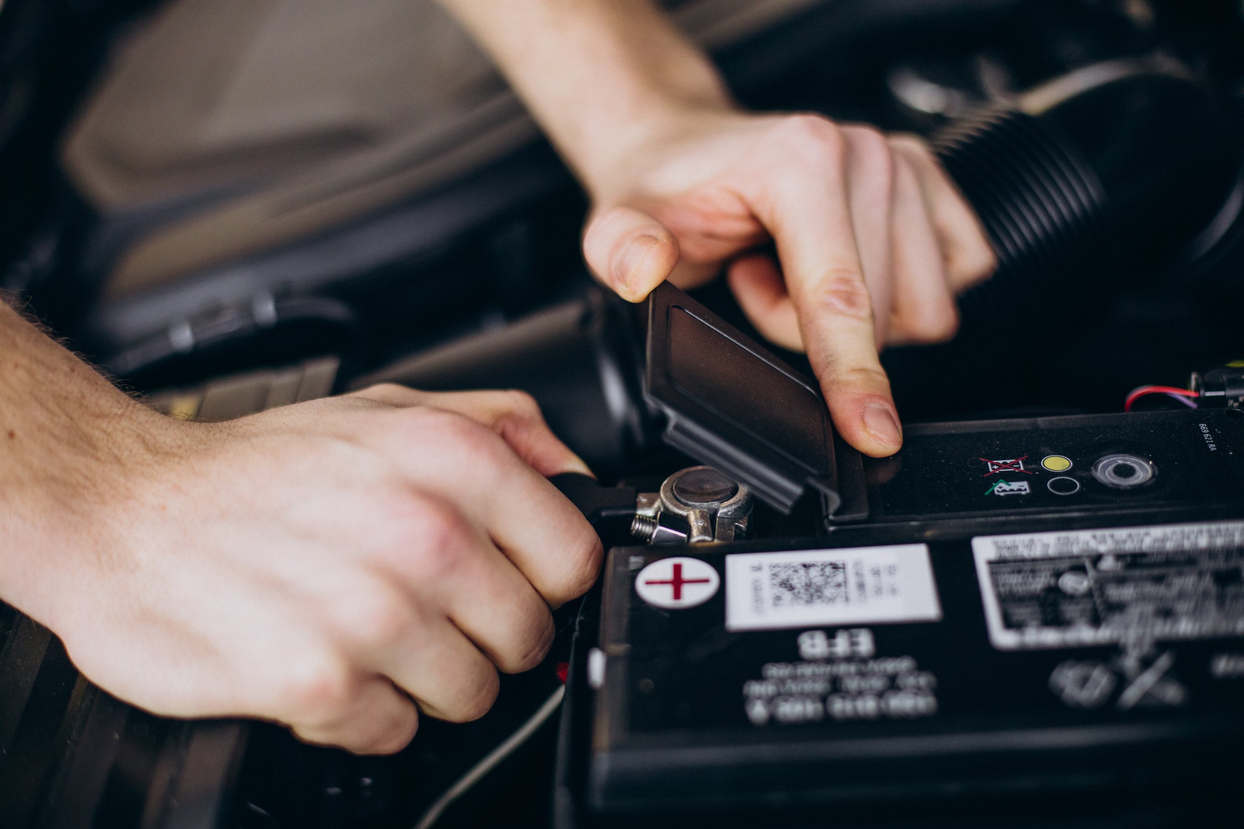 Man fixing car engine