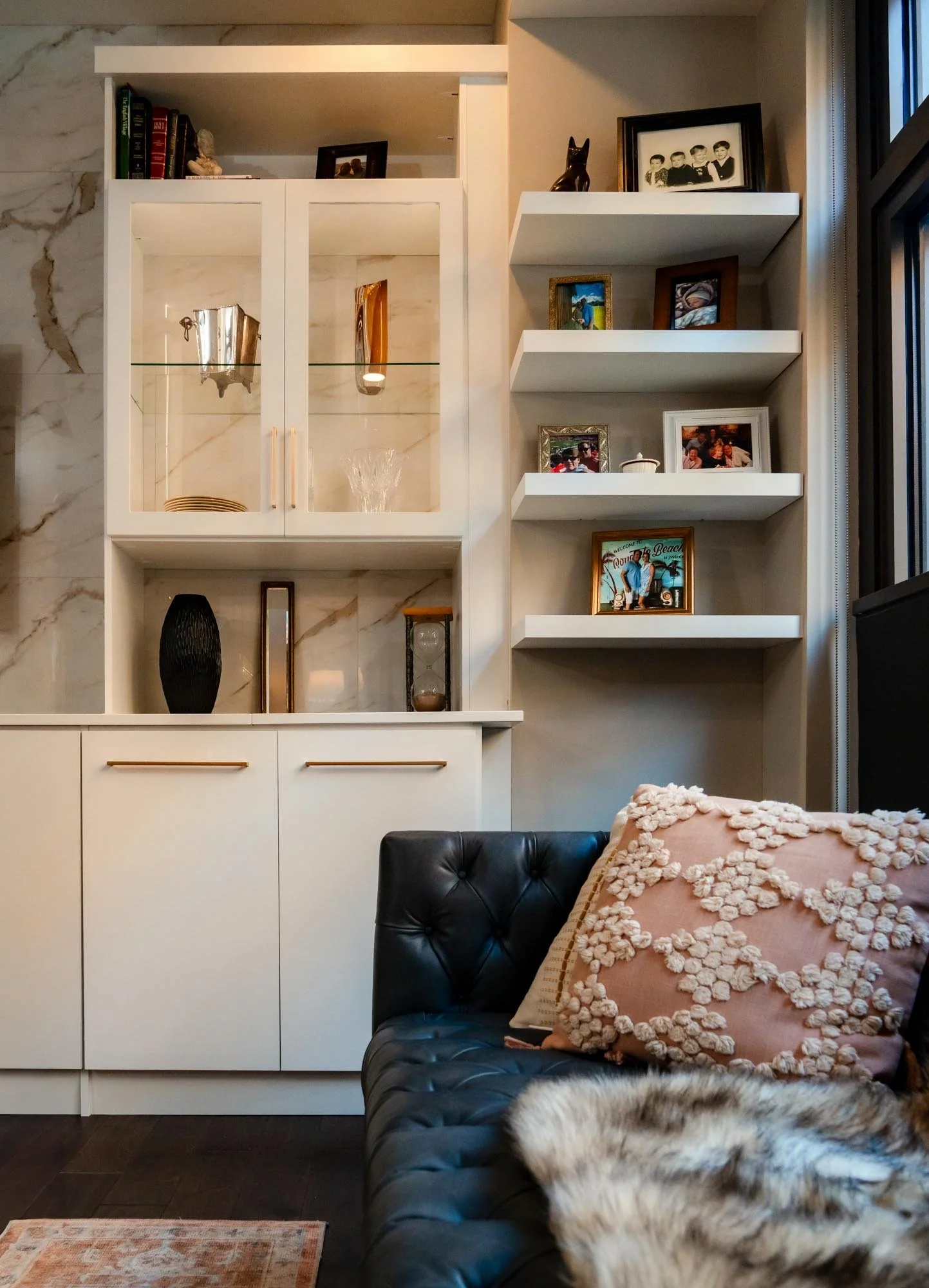 Living room built-in cabinetry and shelving displaying decorative items and photos in Columbus, Ohio.
