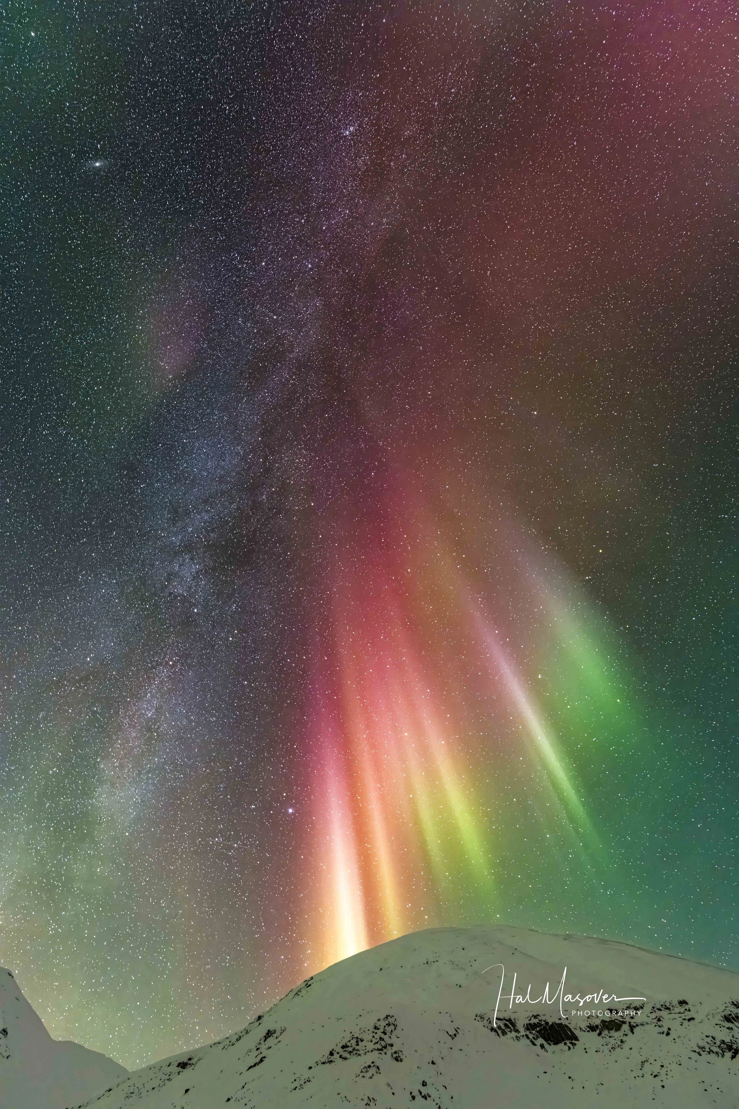 Auroras down from the Milky Way over Alaska