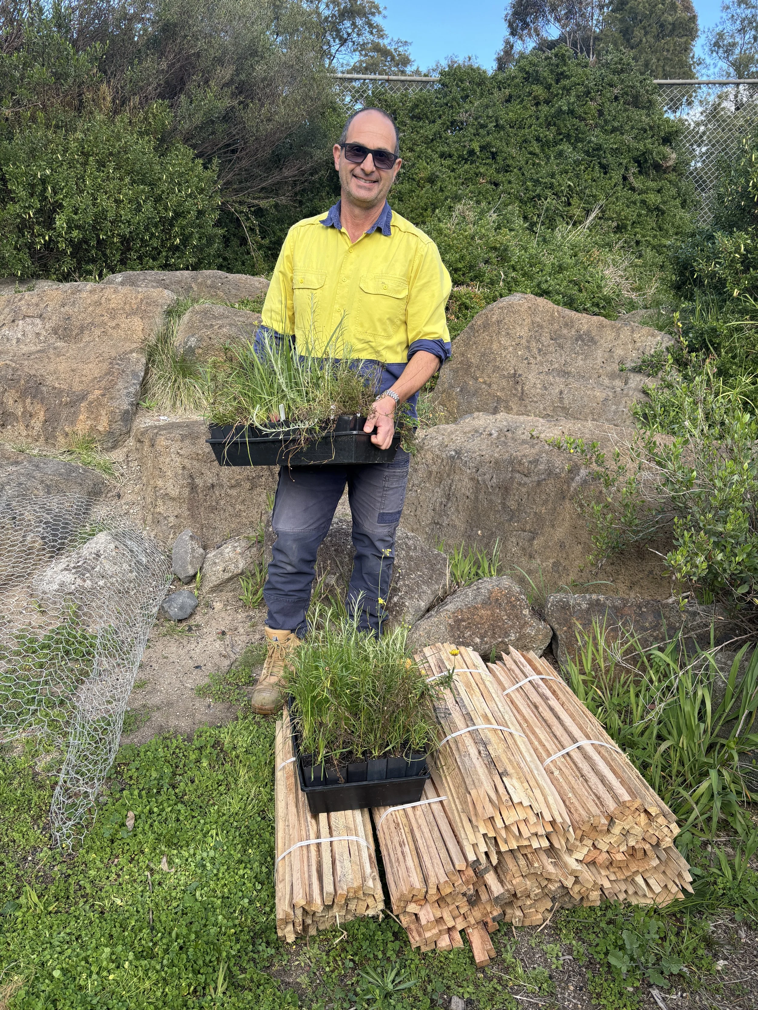 Vince Andreana, Natural Resource Management Officer for Merri-Bek City Council, with tubestocks and stakes for Yakai Barring donated by Merri-Bek City Council 