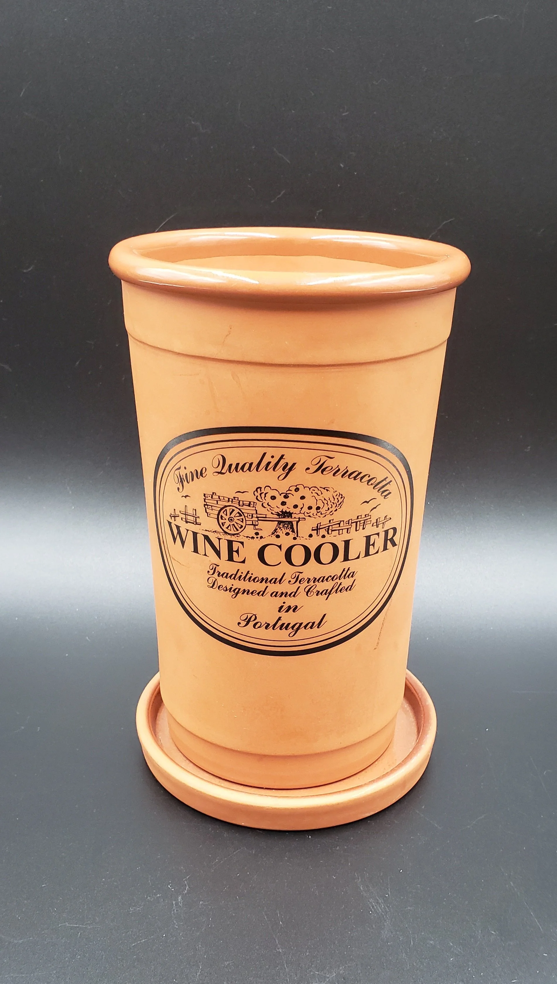 Terracotta wine cooler with a label reading 'Fine Quality Terracotta, Wine Cooler, Traditional Terracotta, Designed and Crafted in Portugal.'