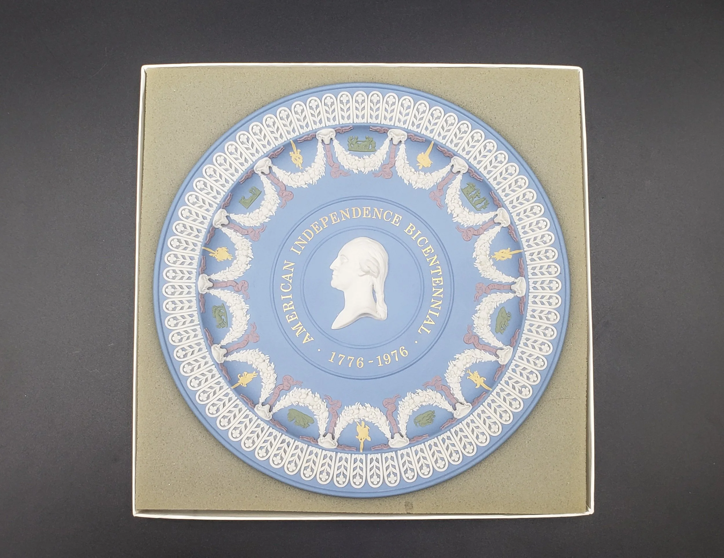 Decorative commemorative plate celebrating American bicentennial, 1776-1976, with an image of George Washington in profile at the center.