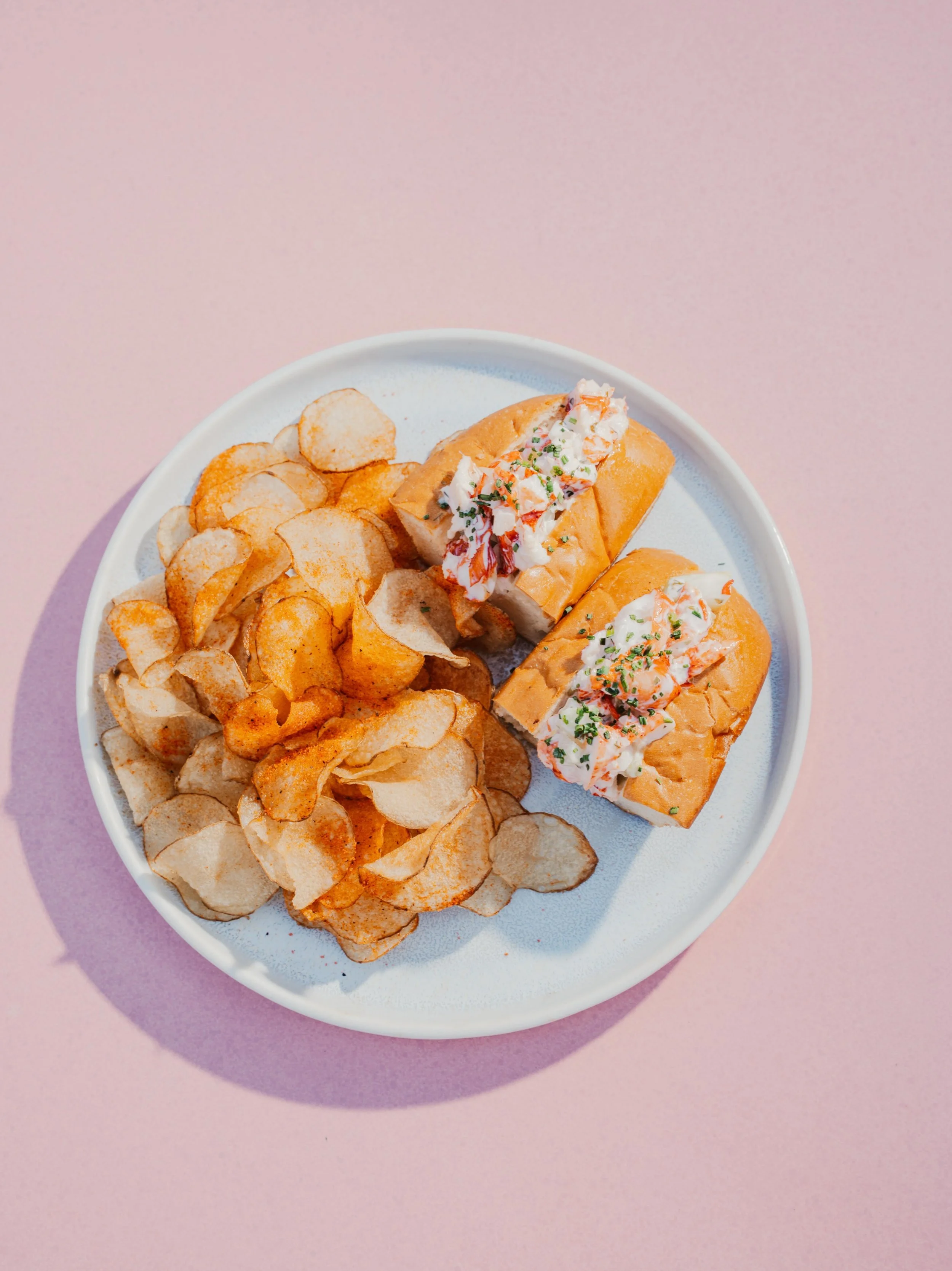 Summer called. We answered with Lobster Rolls🦞✨

Butter-poached lobster, green tomato remoulade on a milk bread roll served with our signature BBQ chips 😋