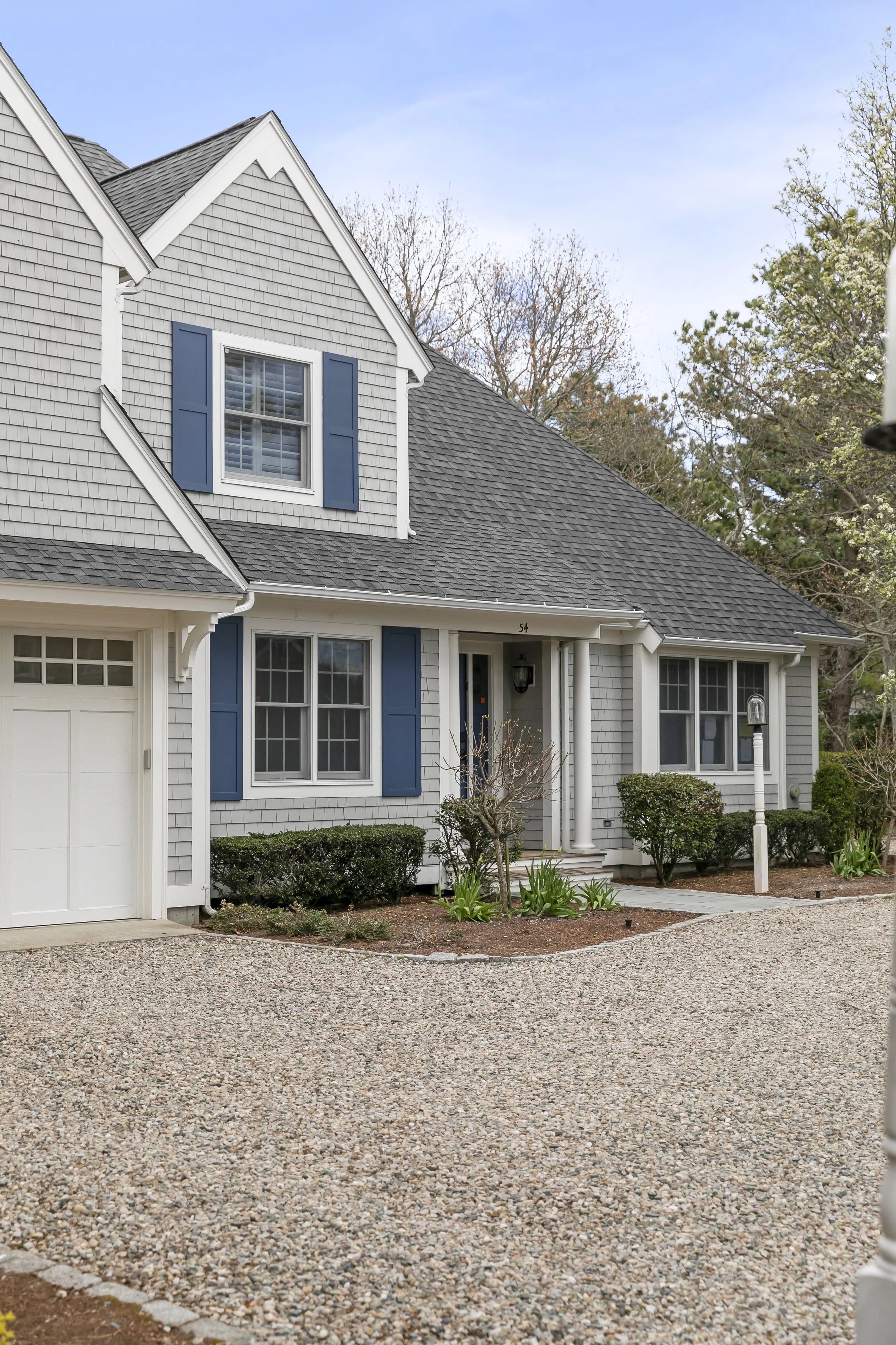 Side view image of a new construction home in New Seabury, MA