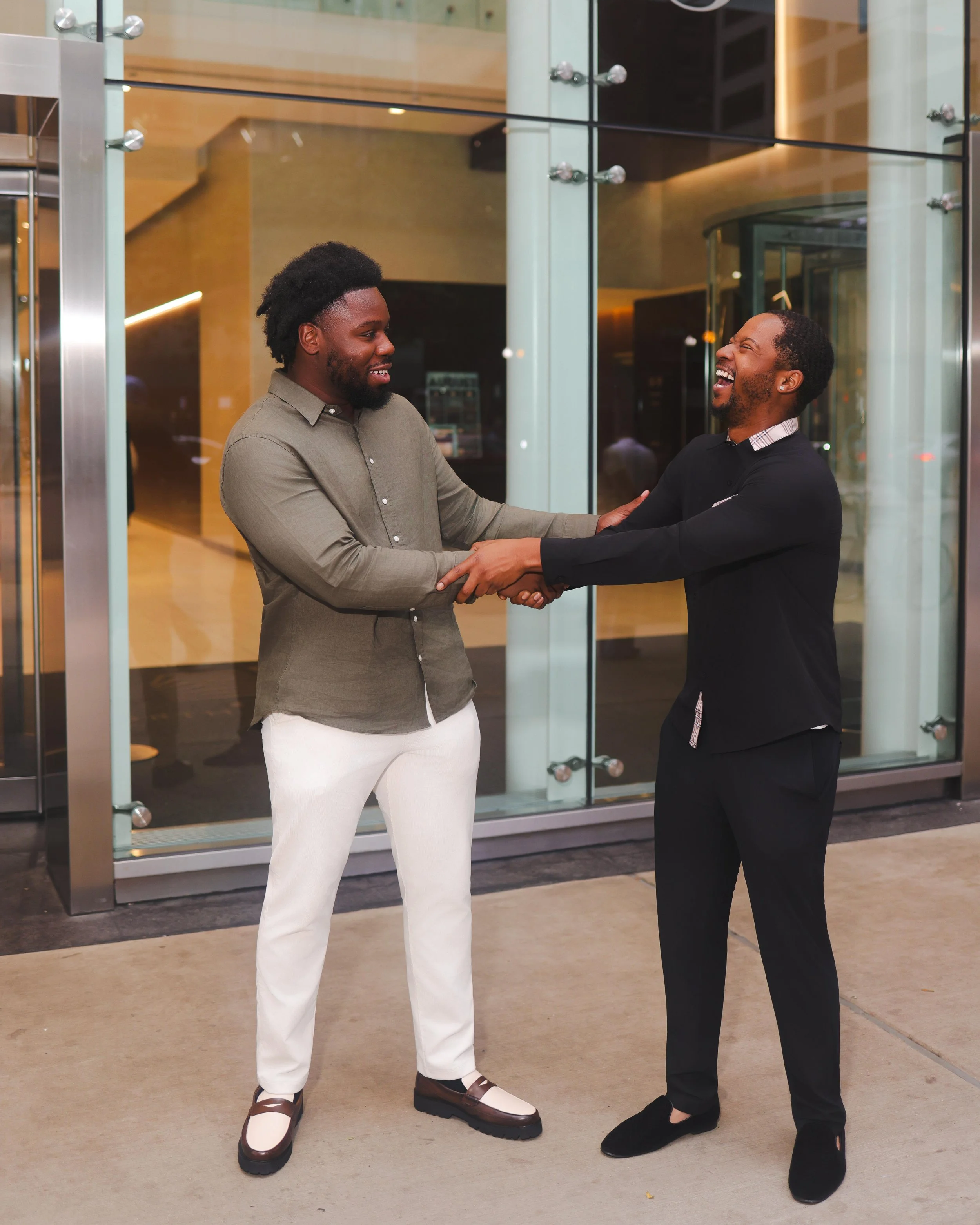 a picture of Taj Taylor and Erion Hogan. Erion Hogan on the left, Taj Taylor on the right. Both Co-founders of Movemint Moving