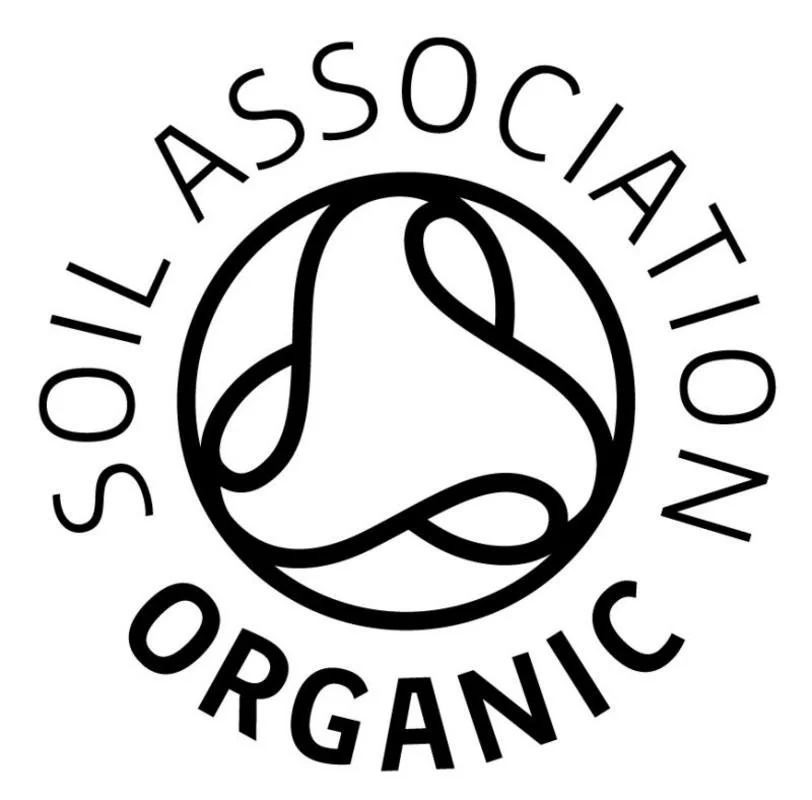 Logo for Soil Association Organic, featuring a circular design with a stylized, intertwined leaf and plant motif in the center.