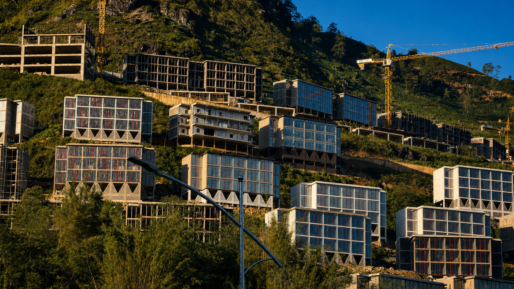 Large hotel complex under construction on the mountainsides surrounding Sapa, Vietnam.