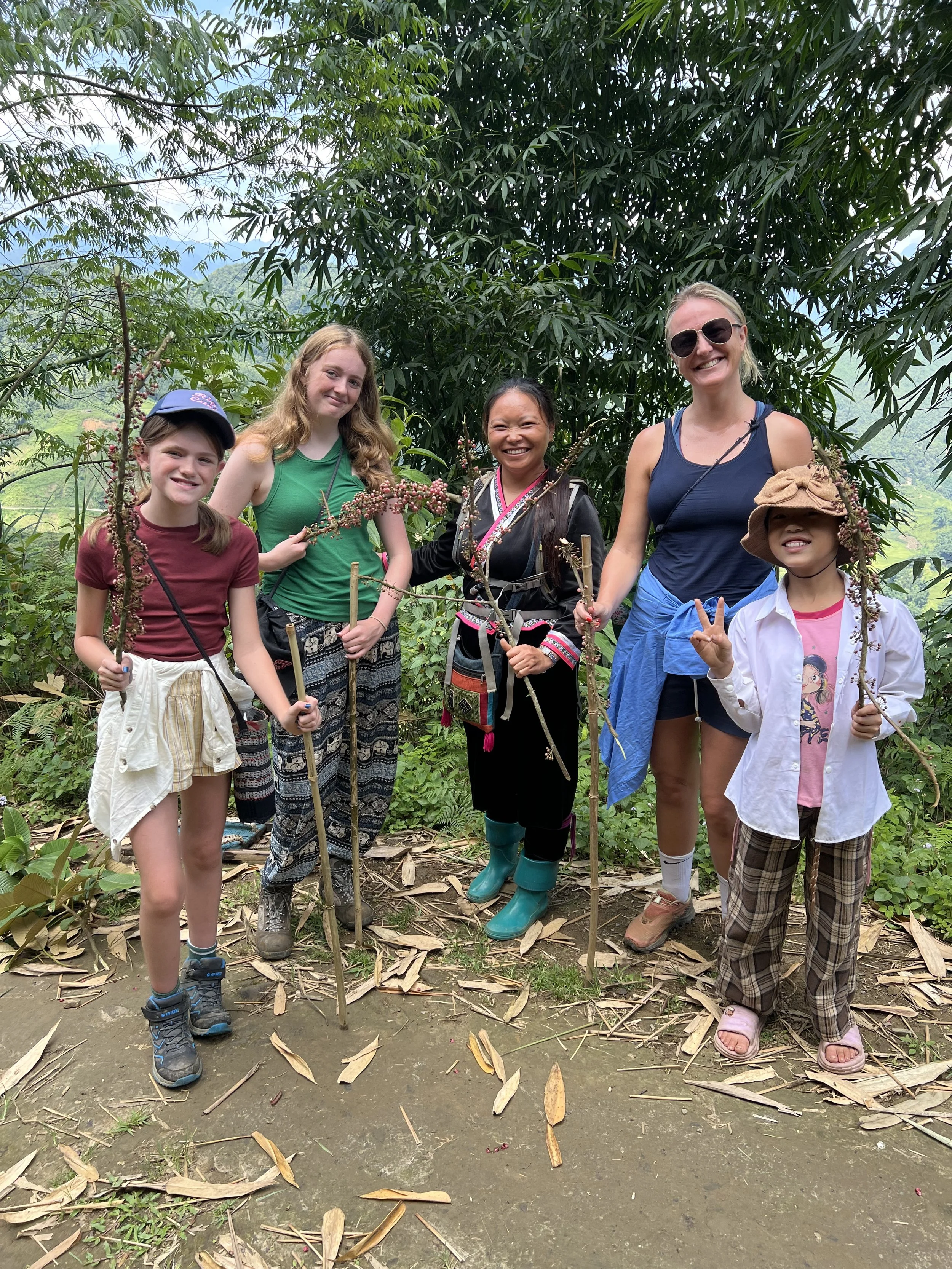 Family posing with local guides during Sapa trek
