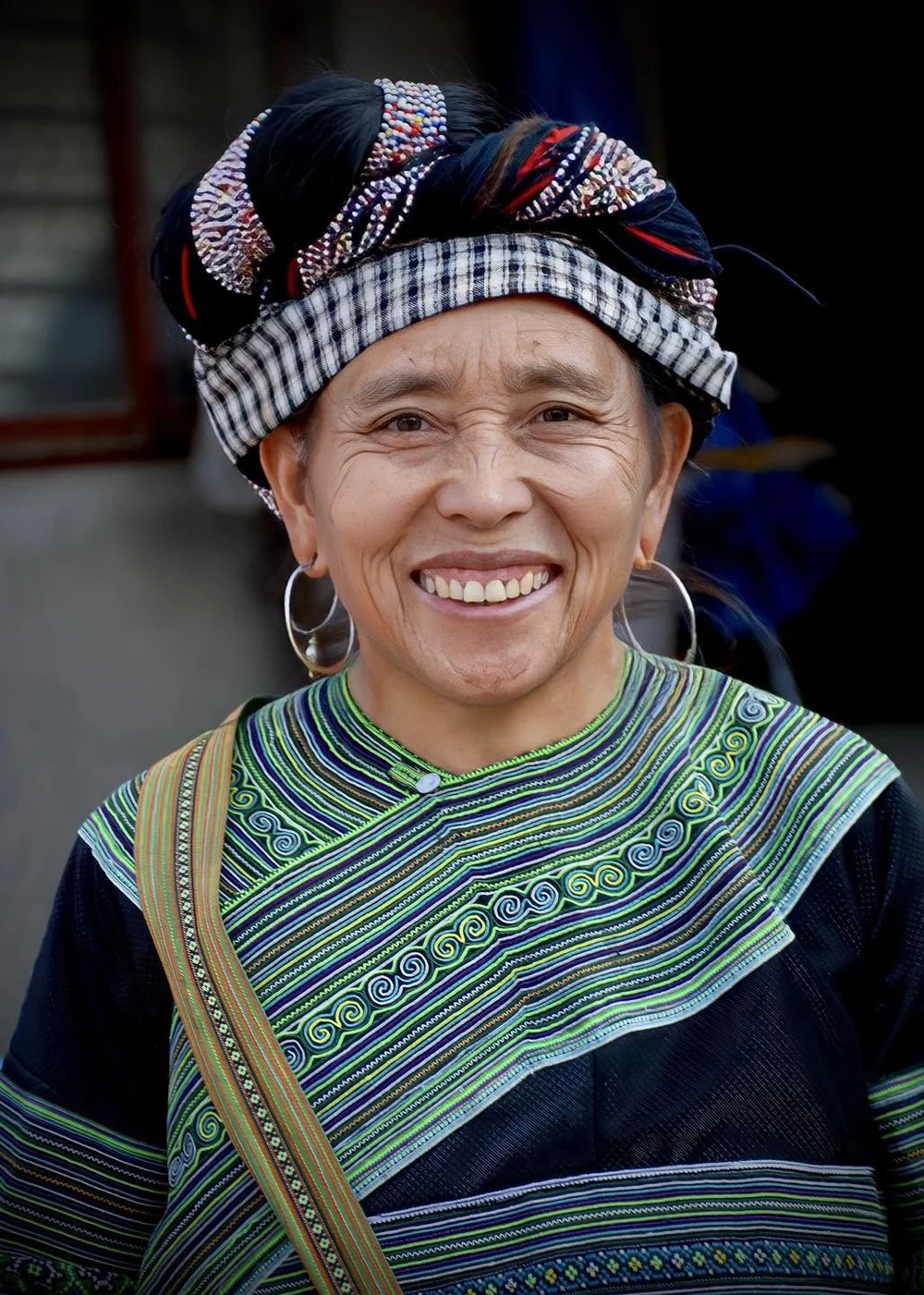 Smiling Woman in Traditional Patterned Shawl