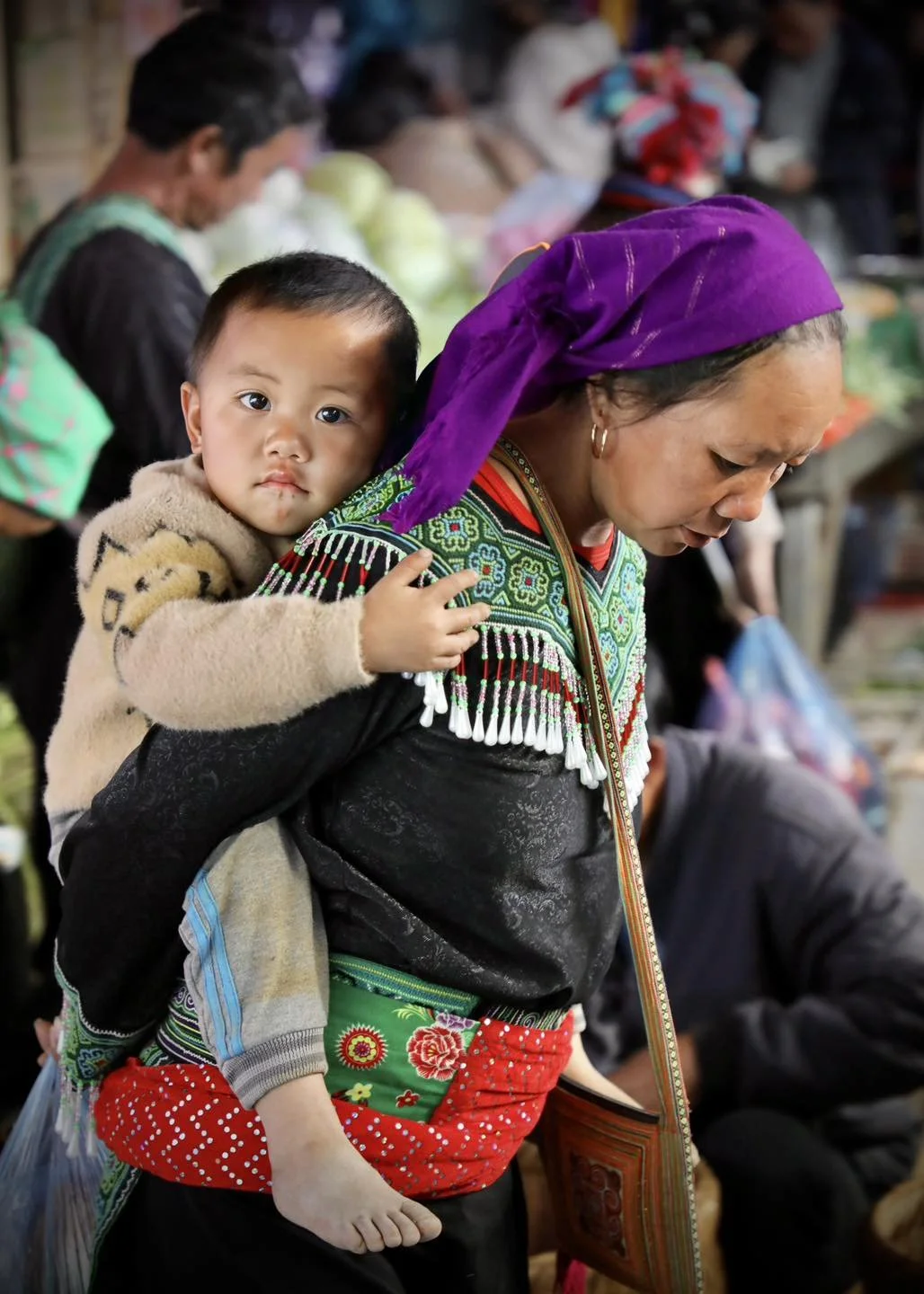 Mother Carrying Her Child