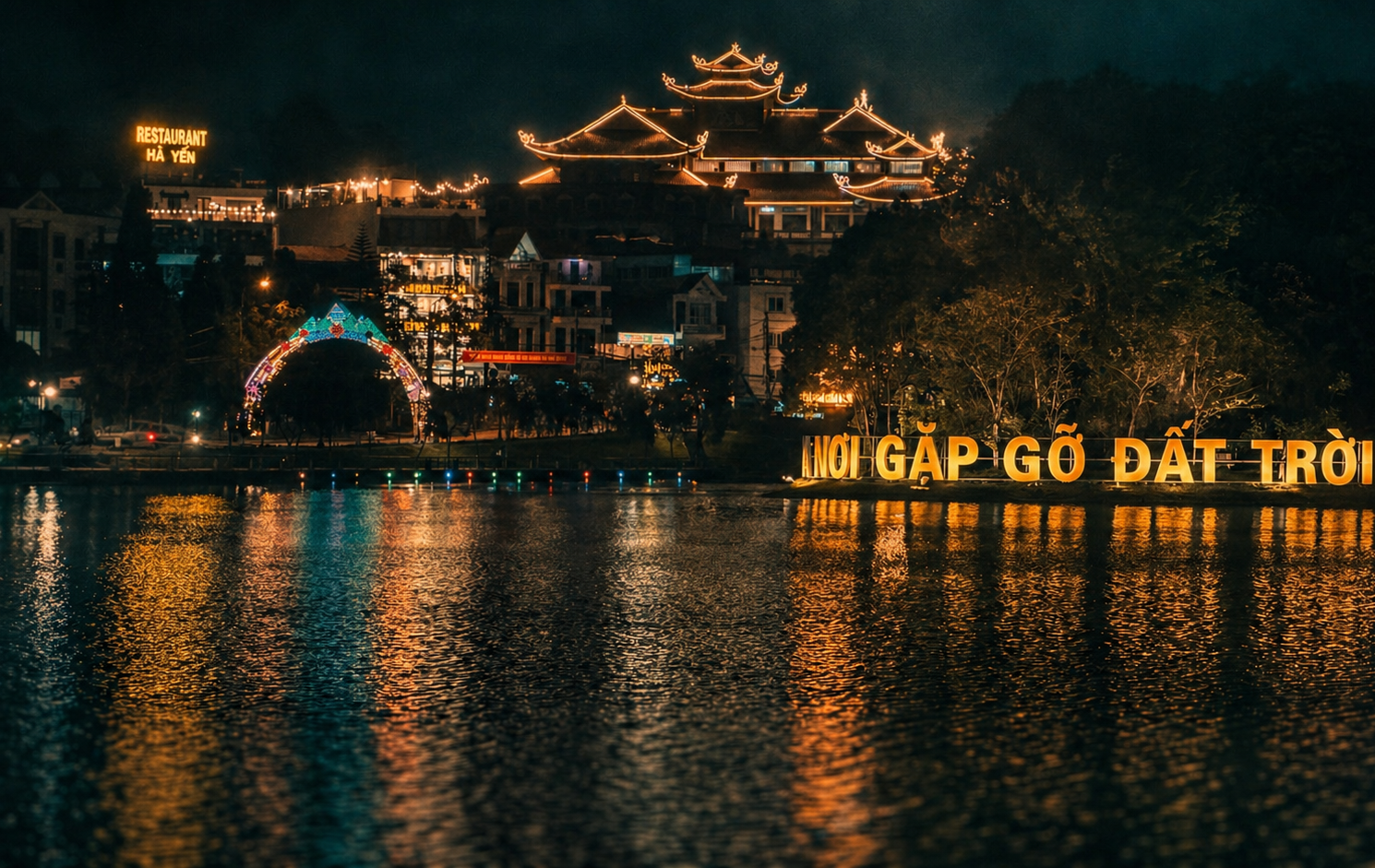 Night view of Sapa Lake illuminated by modern tourism developments and decorative lighting in 2026.
