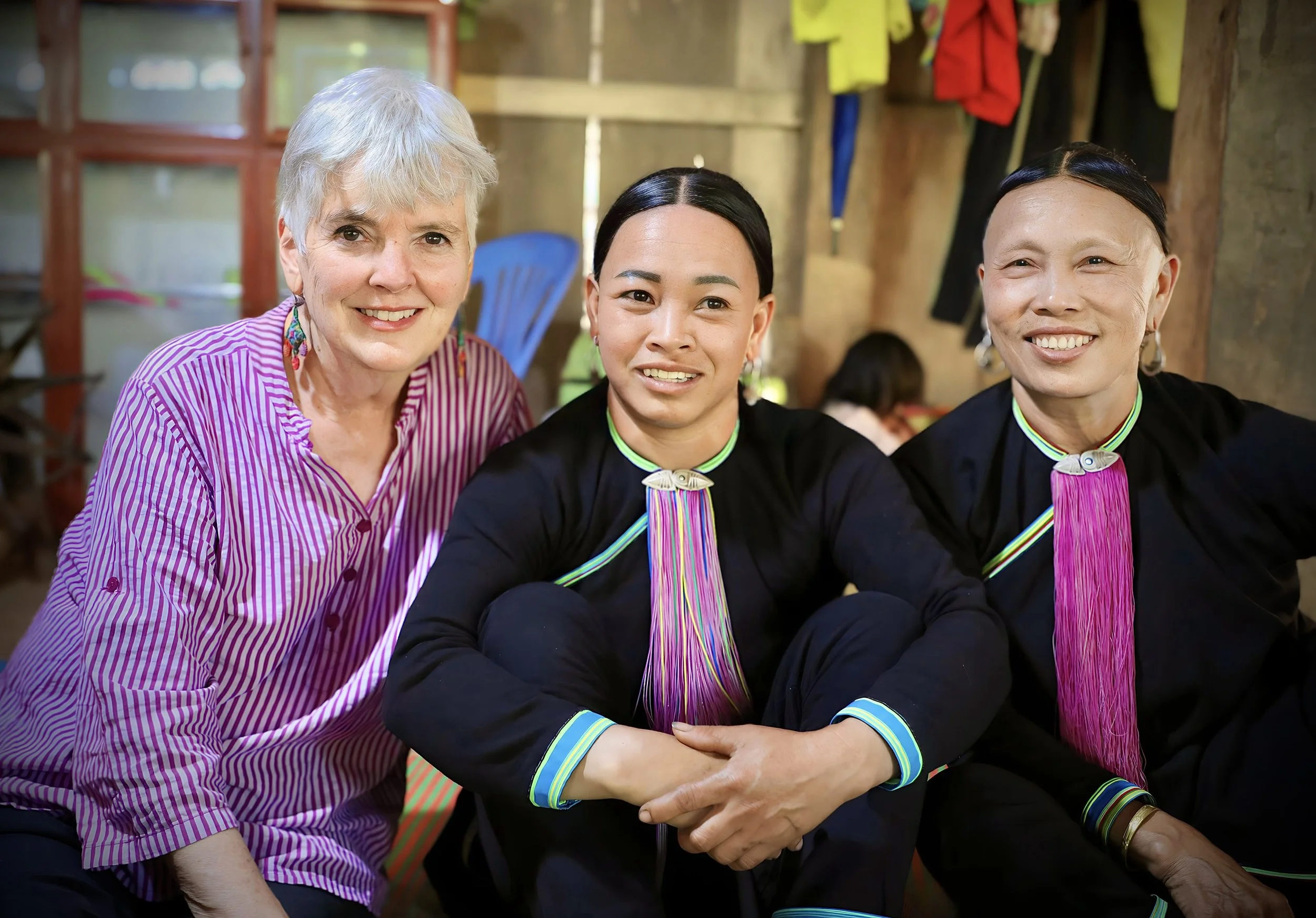 Traveller enjoying cultural homestay experience with local ethnic minority hosts in Sapa during Northwest Loop by car