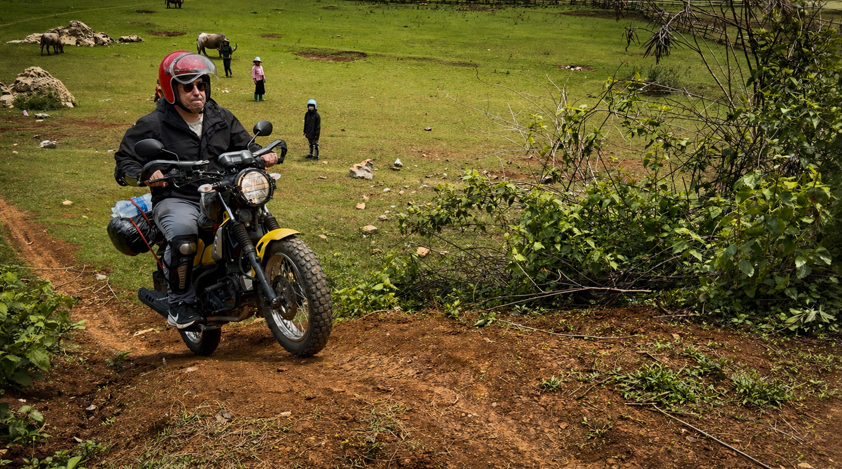Motorbike rider on a dirt trail in Son La Province navigating uneven terrain in a rural mountain setting in northern Vietnam