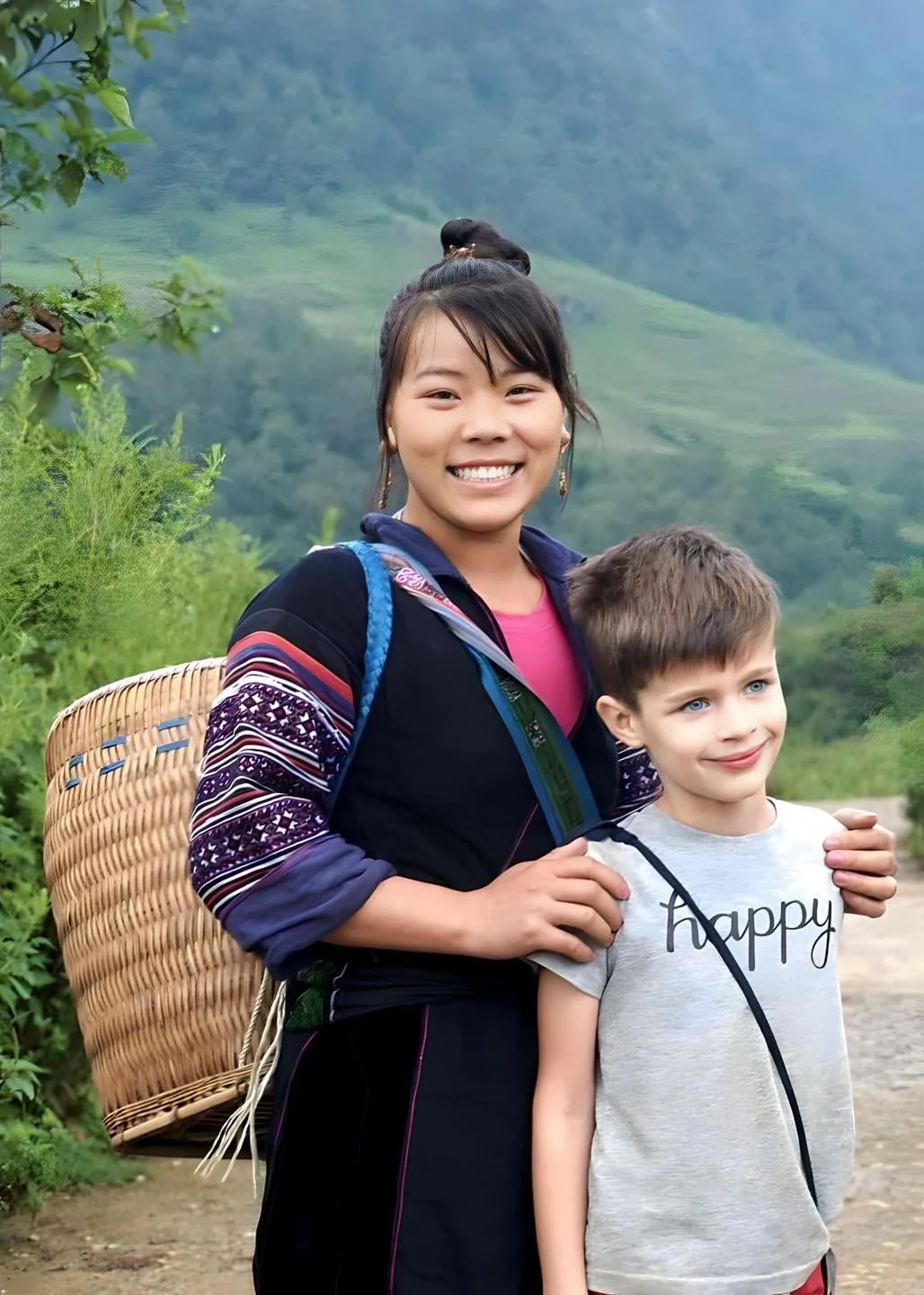 Local woman with a young international visitor in the mountains of Northern Vietnam.