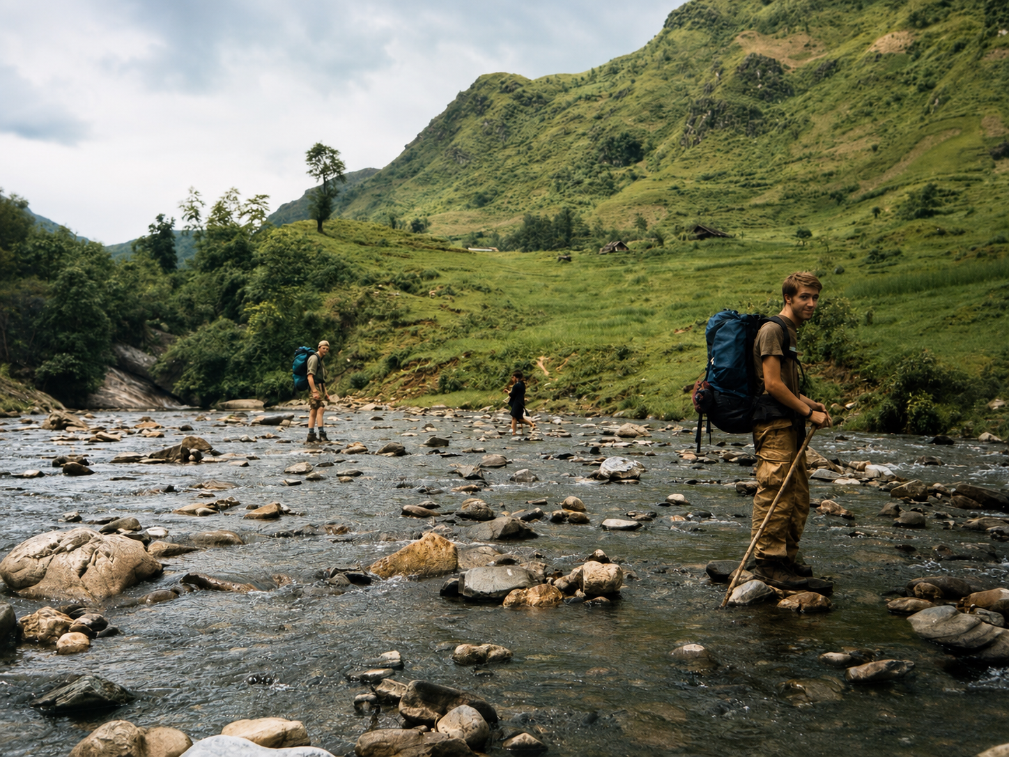 Frontier researchers crossing a rocky mountain stream during a biodiversity expedition in the Hoàng Liên Mountains near Sapa in 1998.