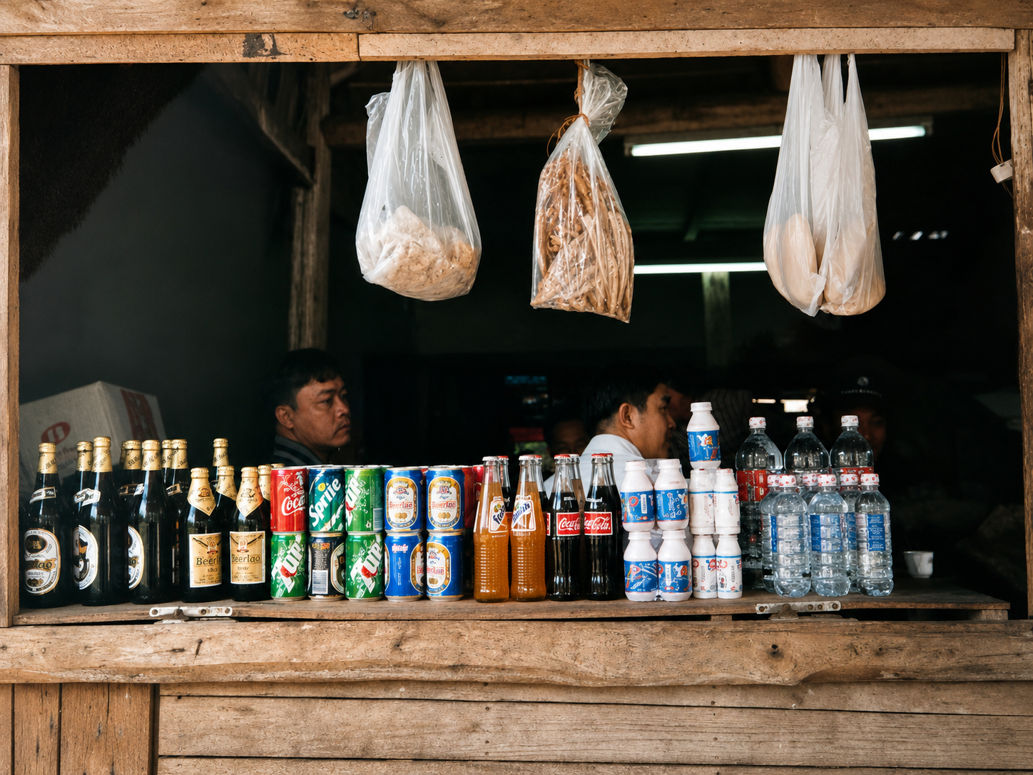 Small family-run shop in Sapa displaying bottled drinks, snacks and everyday household goods in 1998.