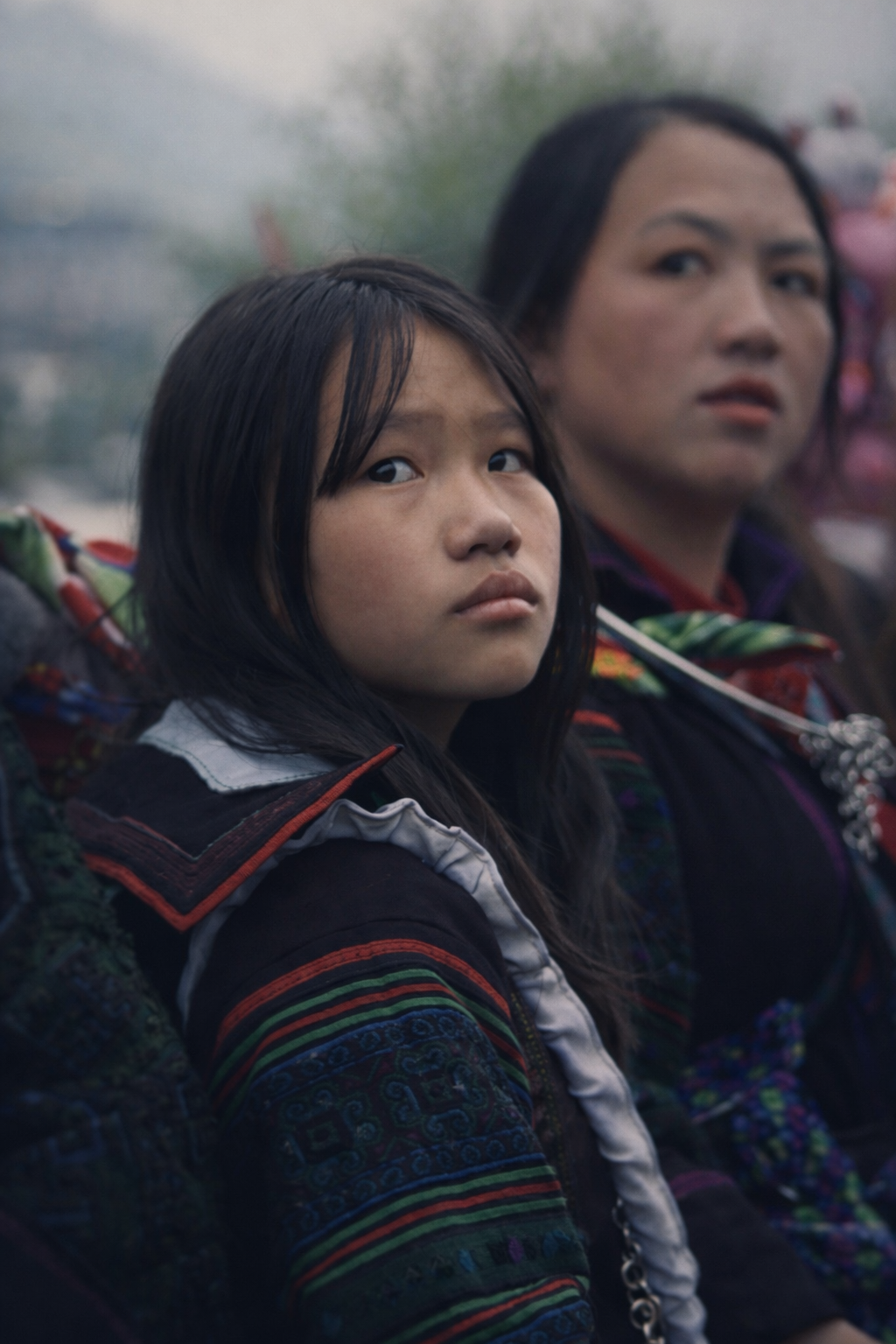 Portrait of Hmong girls in traditional clothing gathered in Sapa during a local community event in 2026.