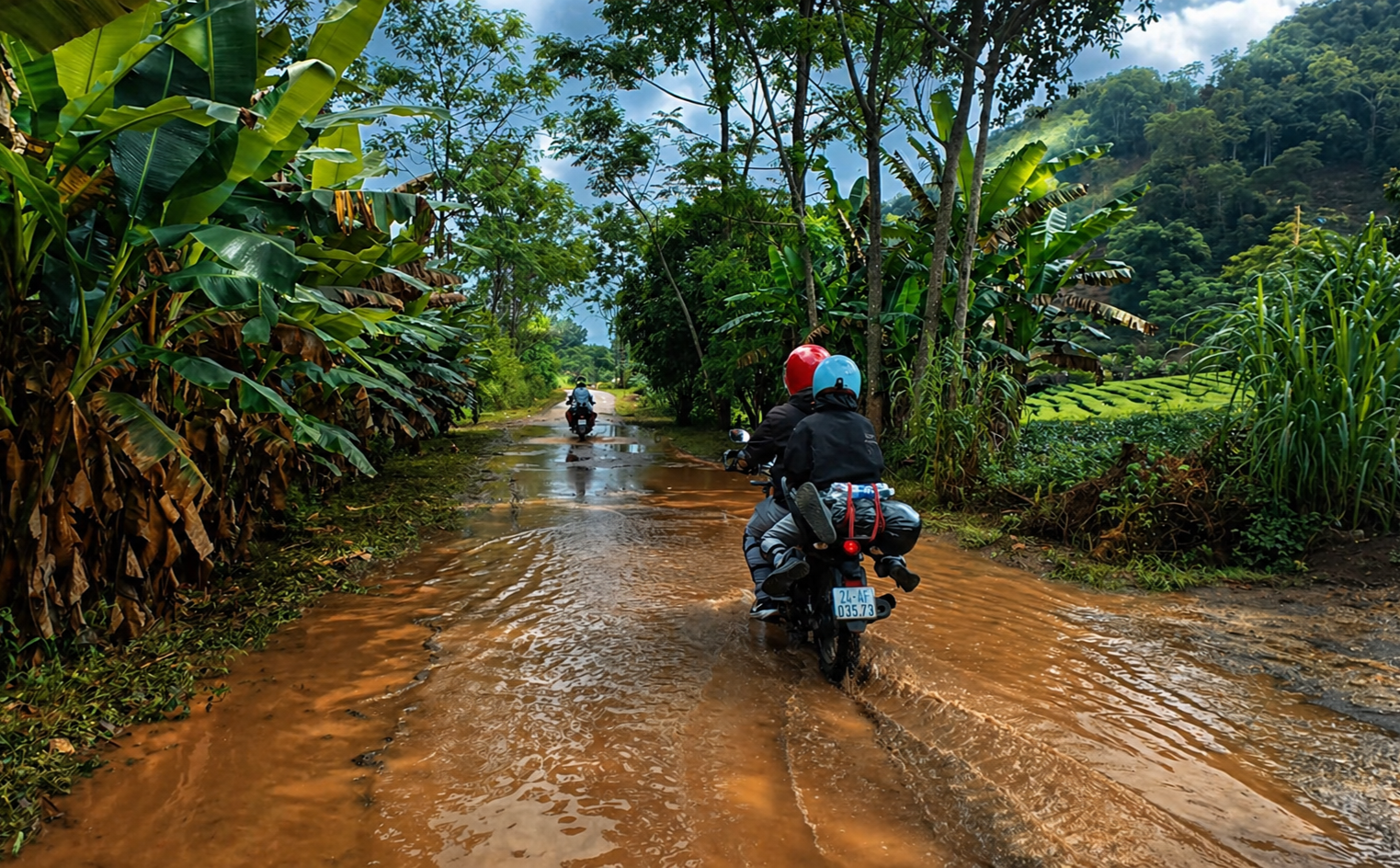 Motorbike riders crossing a flooded rural road in Son La Province during the rainy season in northern Vietnam