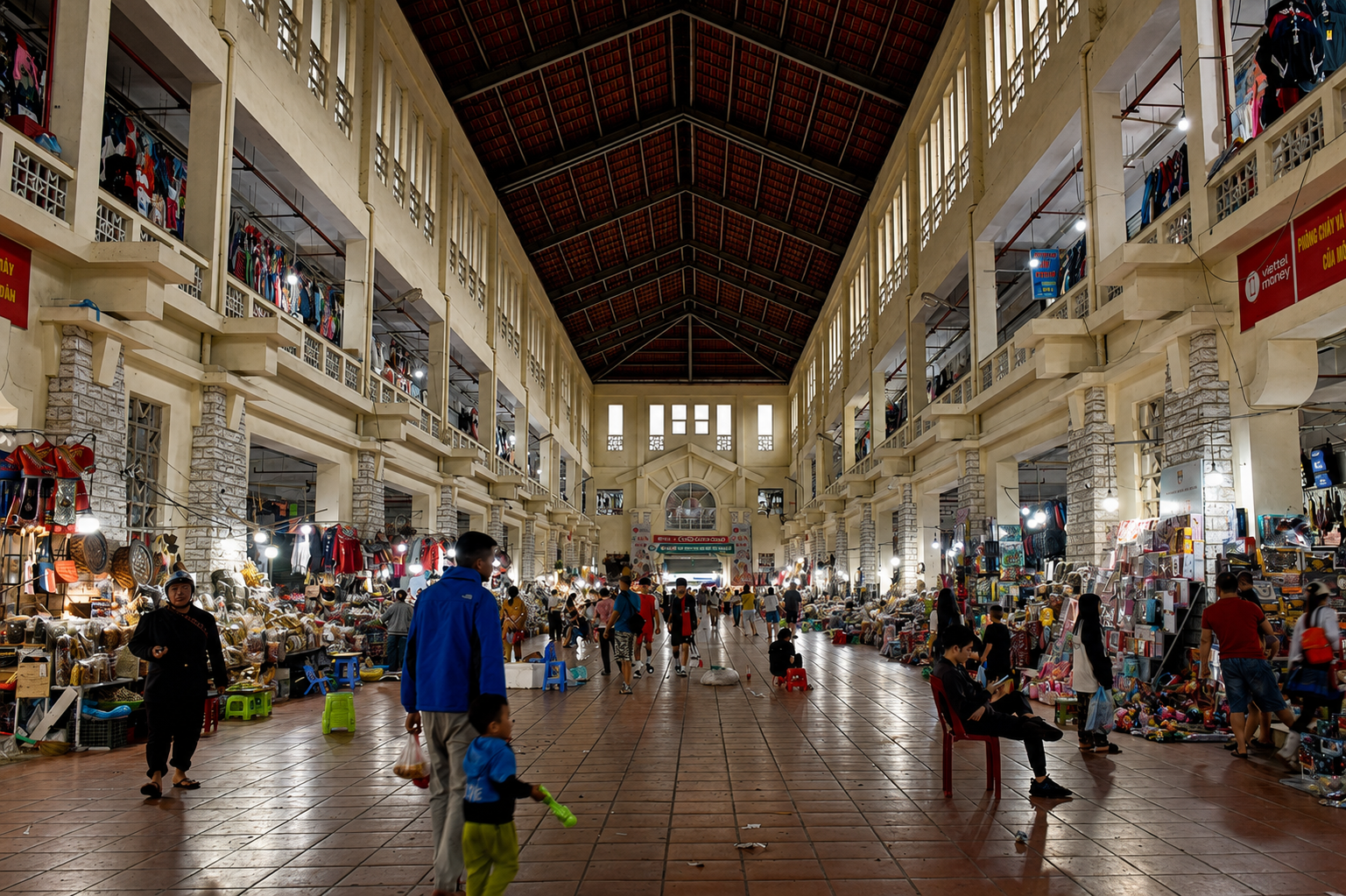 Interior of the modern Sapa Market showing stalls selling textiles, souvenirs, and mass-produced goods within the town’s contemporary tourism economy.