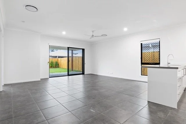 Professional real estate photography of a spacious open concept living room in Ottawa by Charmcam.