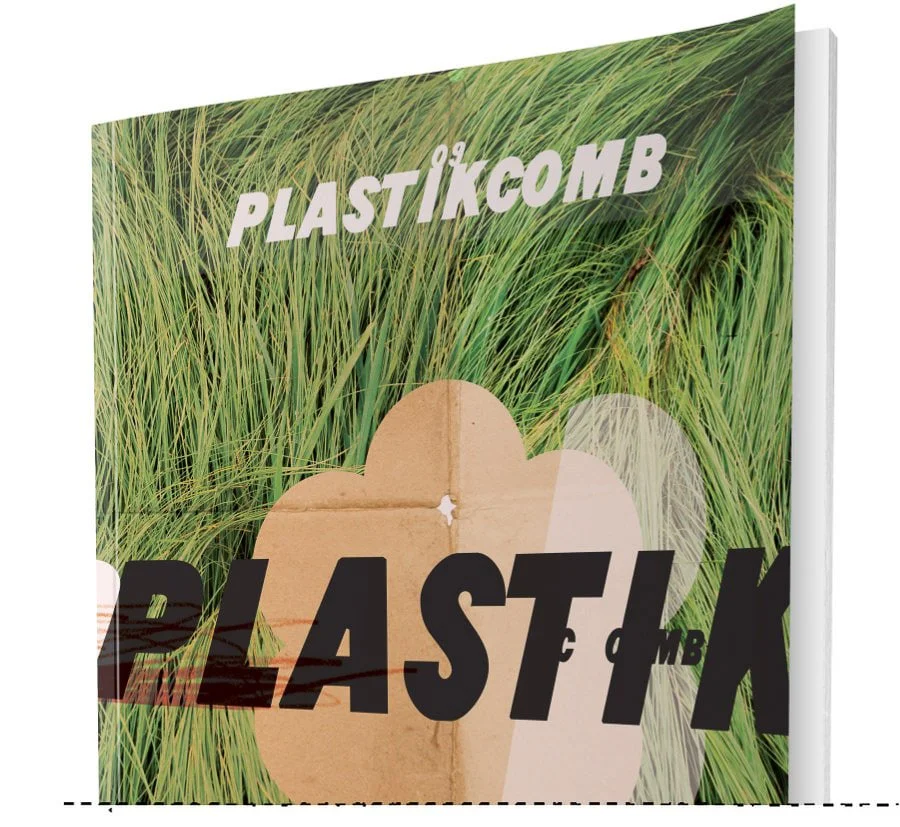 Close-up of a book cover titled "PLASTICÖIKOMBi" with an image of green grass and a plastic and cardboard compound in the background.