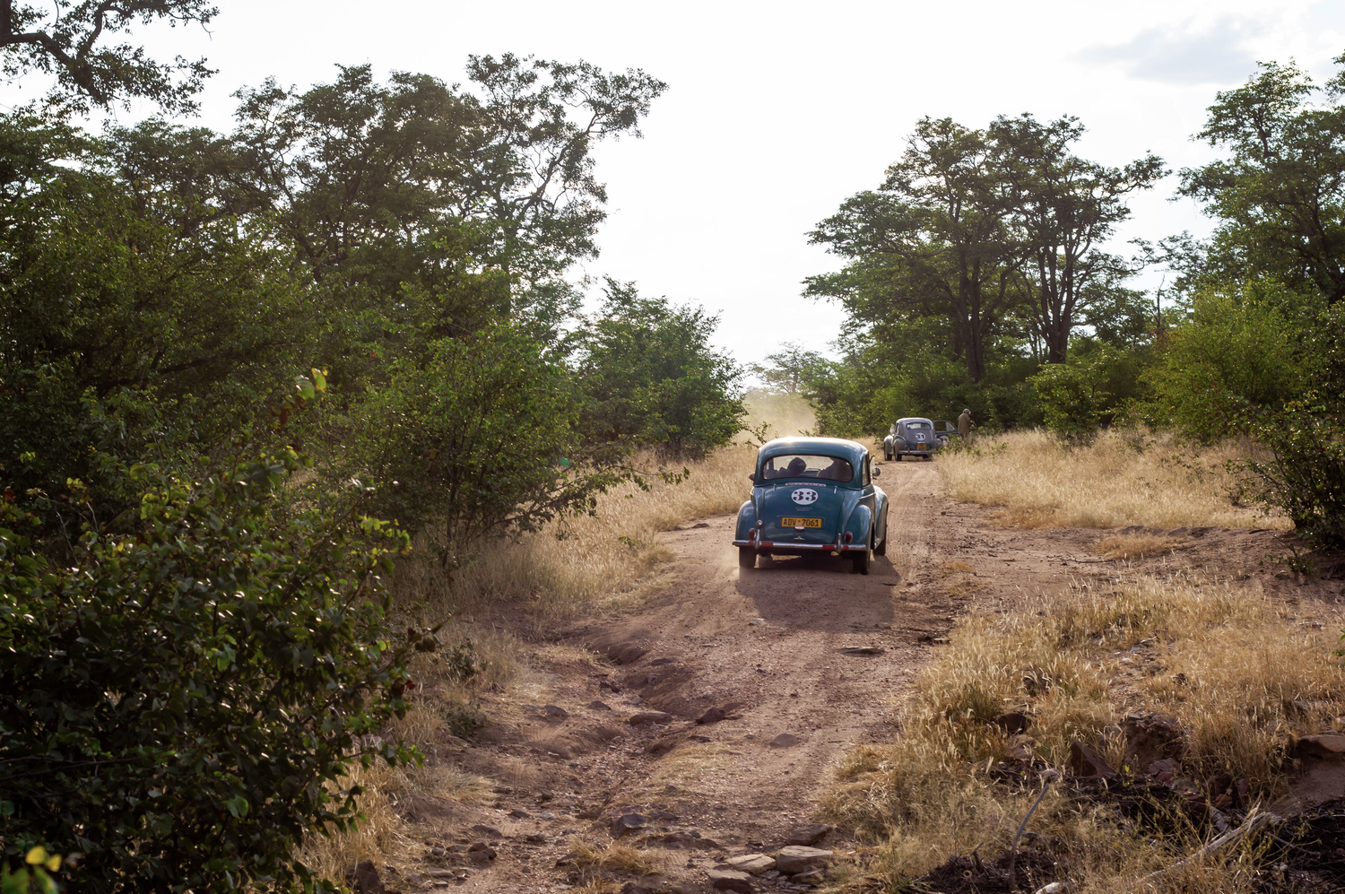Safari Rally participants and their rally car