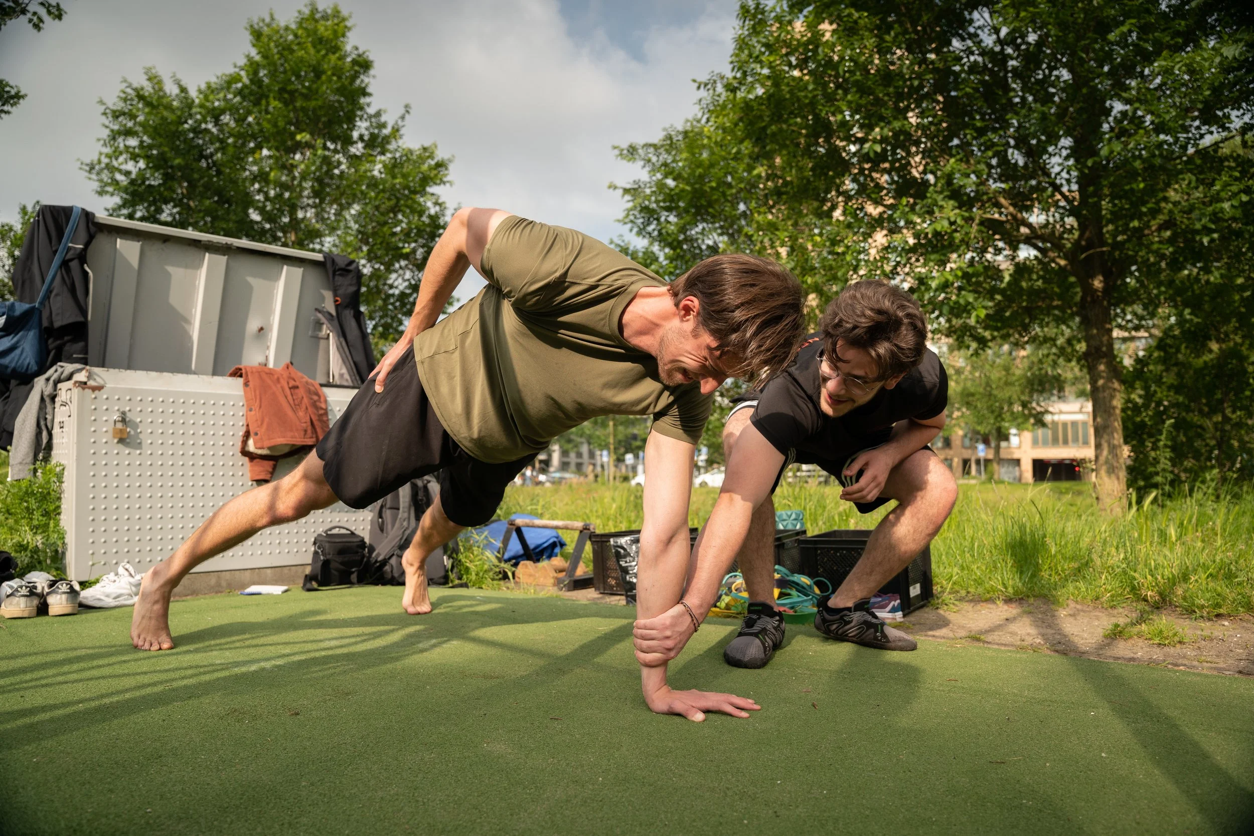 a group of busy professionals over 30 years, training calisthenics at famba, a calisthenics gym in amsterdam west