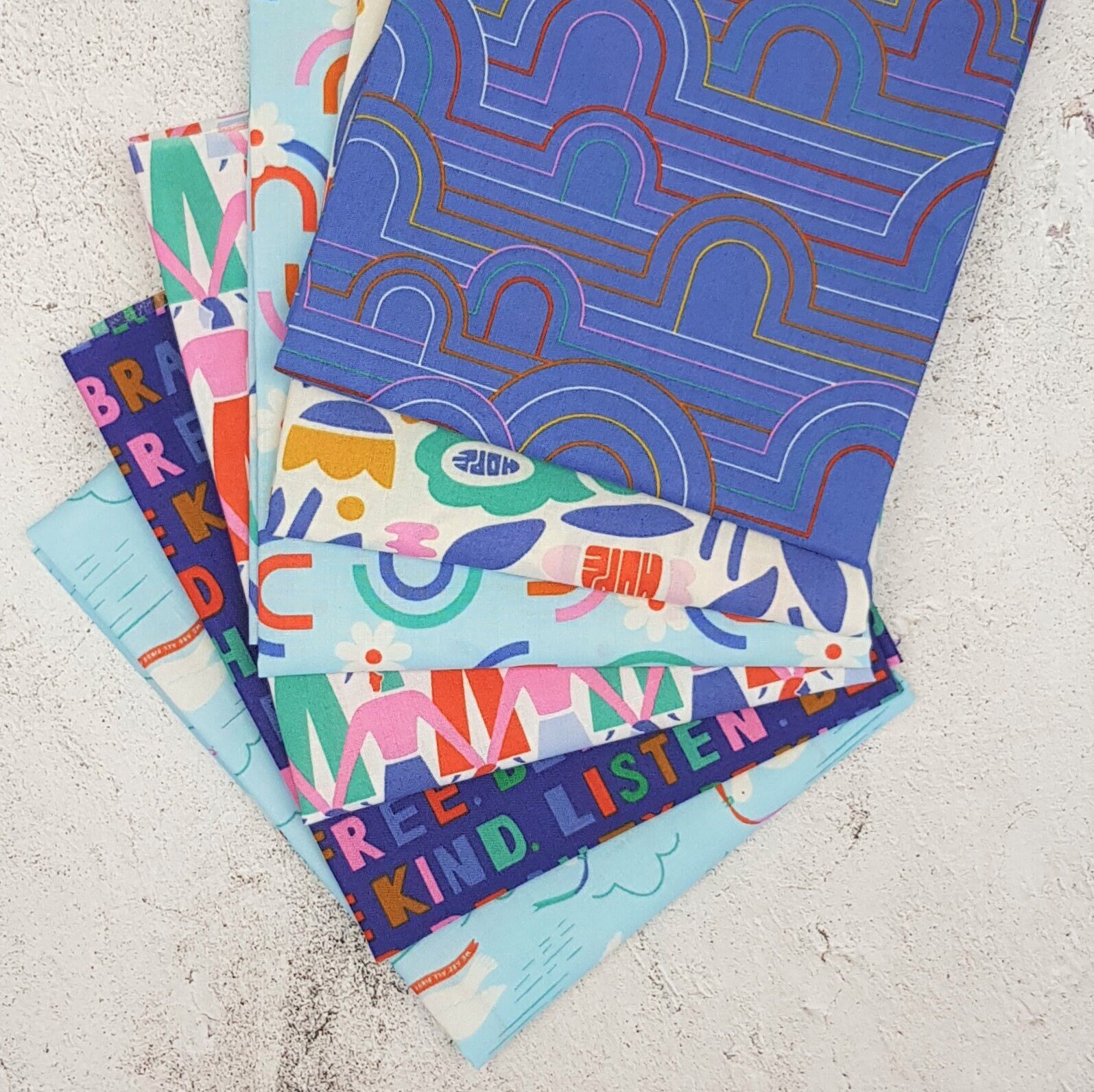 Cloud 9 Fabrics Universal Love Collection fat quarter bundle with 6 organic cotton fabrics for quilting and sewing.