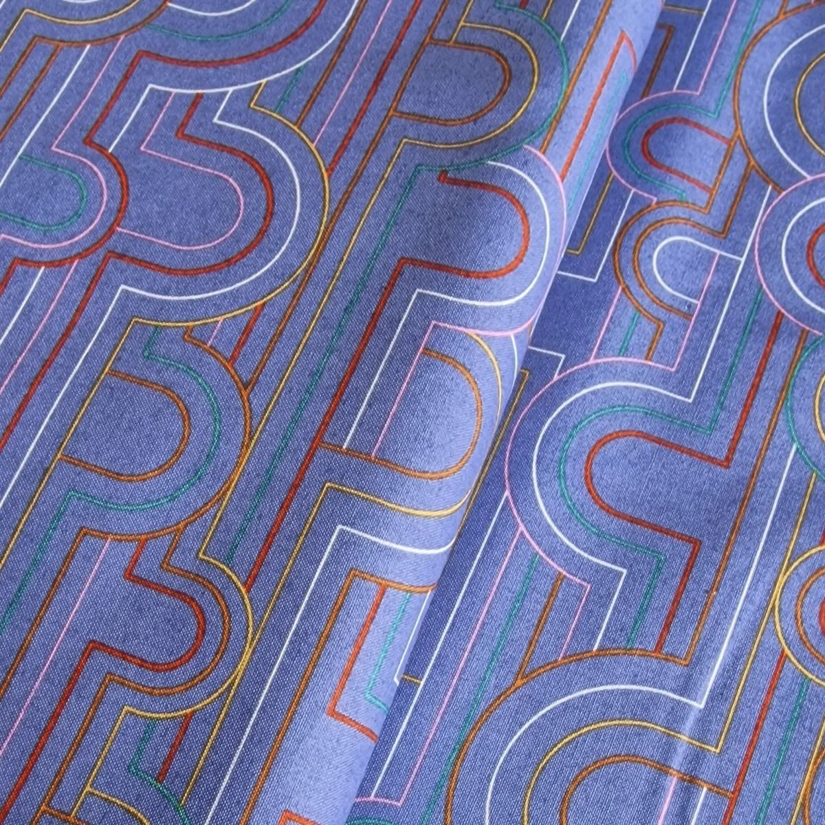 Cloud 9 organic cotton fabric in blue and geometric pattern