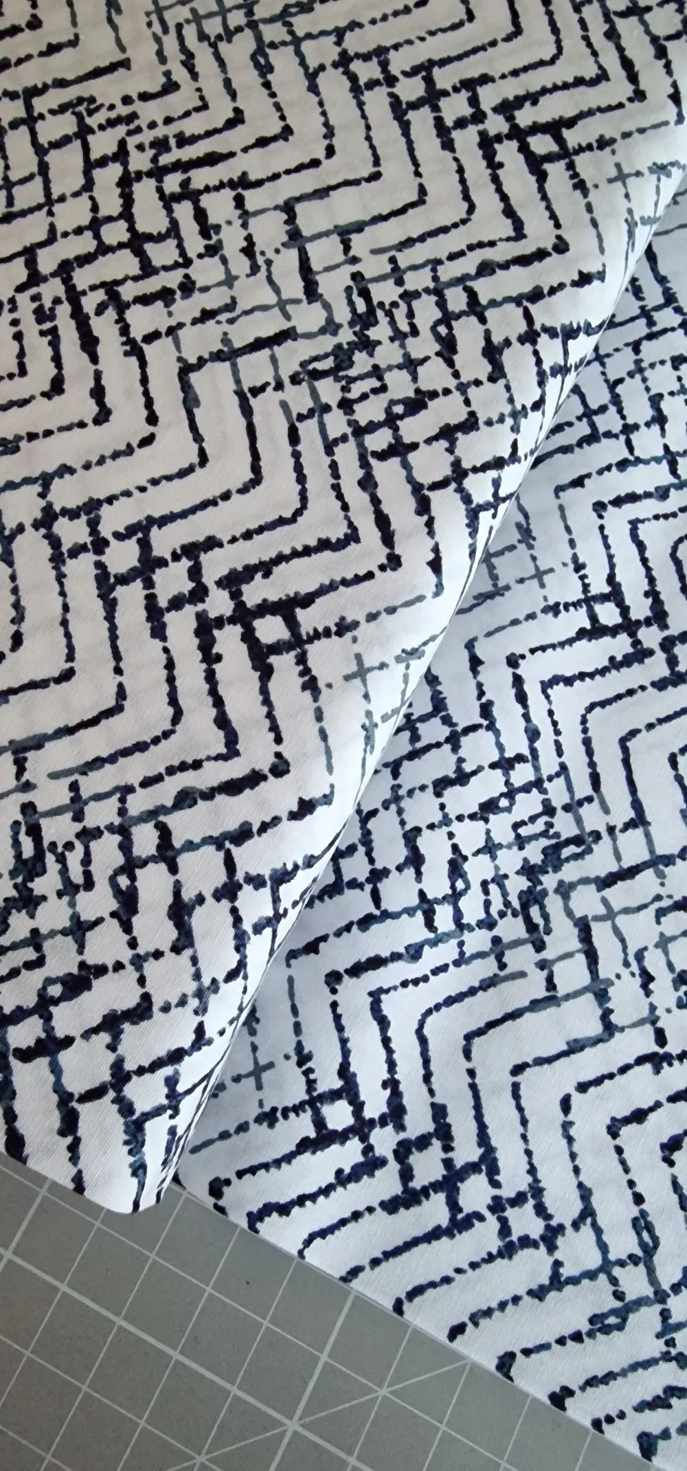 Art Gallery Fabric white background fabric with navy blue geometric pattern
