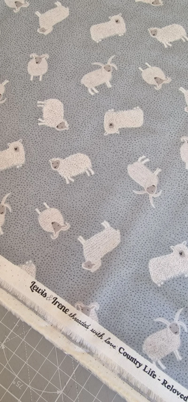 Dotty blue-grey fabric with white sheep pattern by Lewis and Irene from Countrylife collection