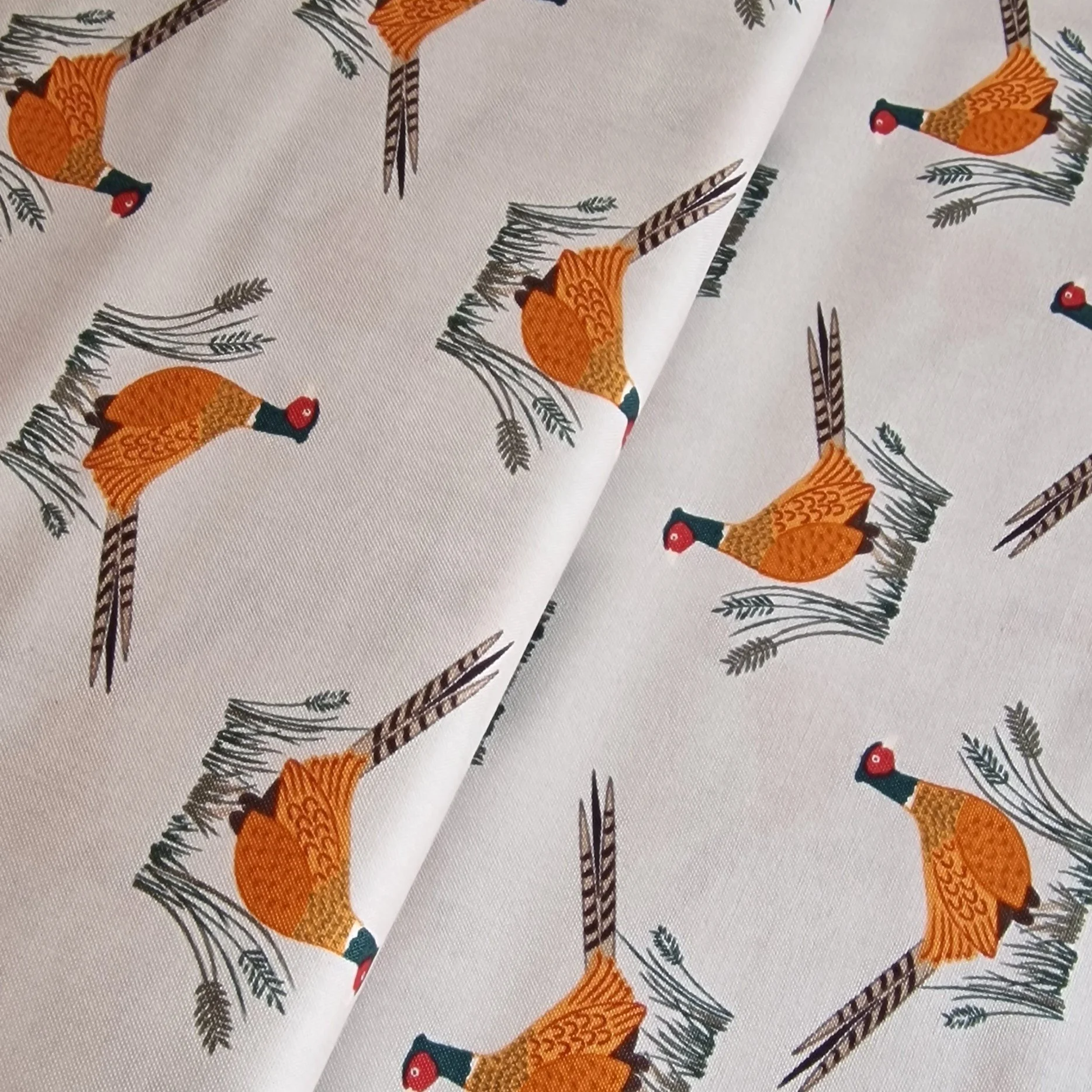 Dark cream fabric with orange pheasants