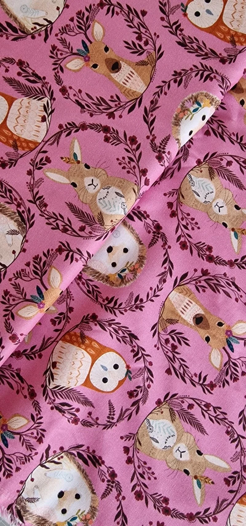 Pink cotton fabric with woodlands animals and leaves