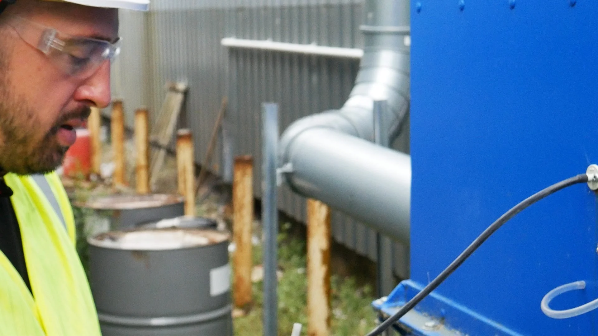 Engineer inspecting a test connection on an extraction unit