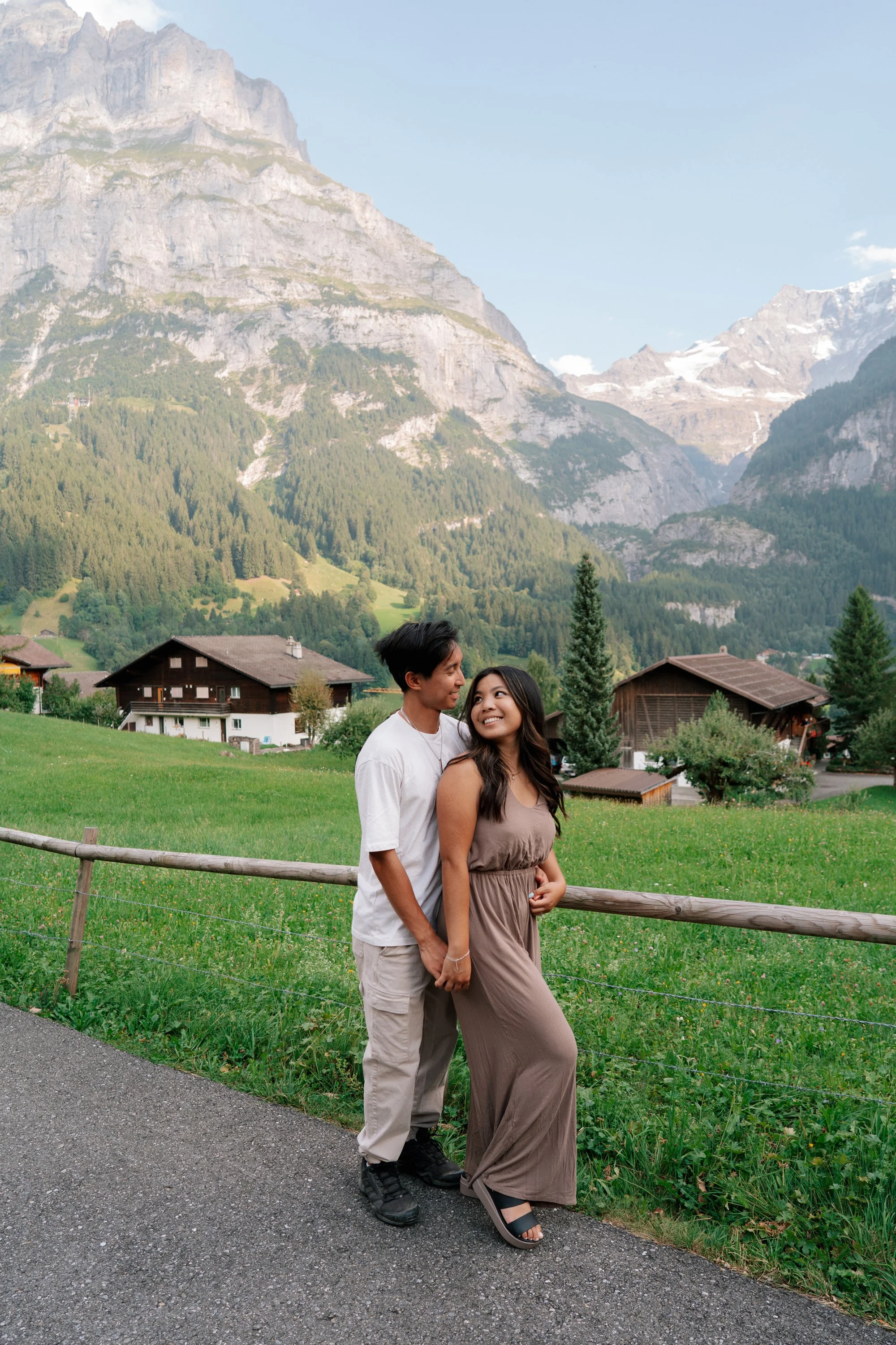 A beautiful late summer couples session in Grindelwald with soft natural light, dramatic alpine backdrops, and intimate storytelling moments.