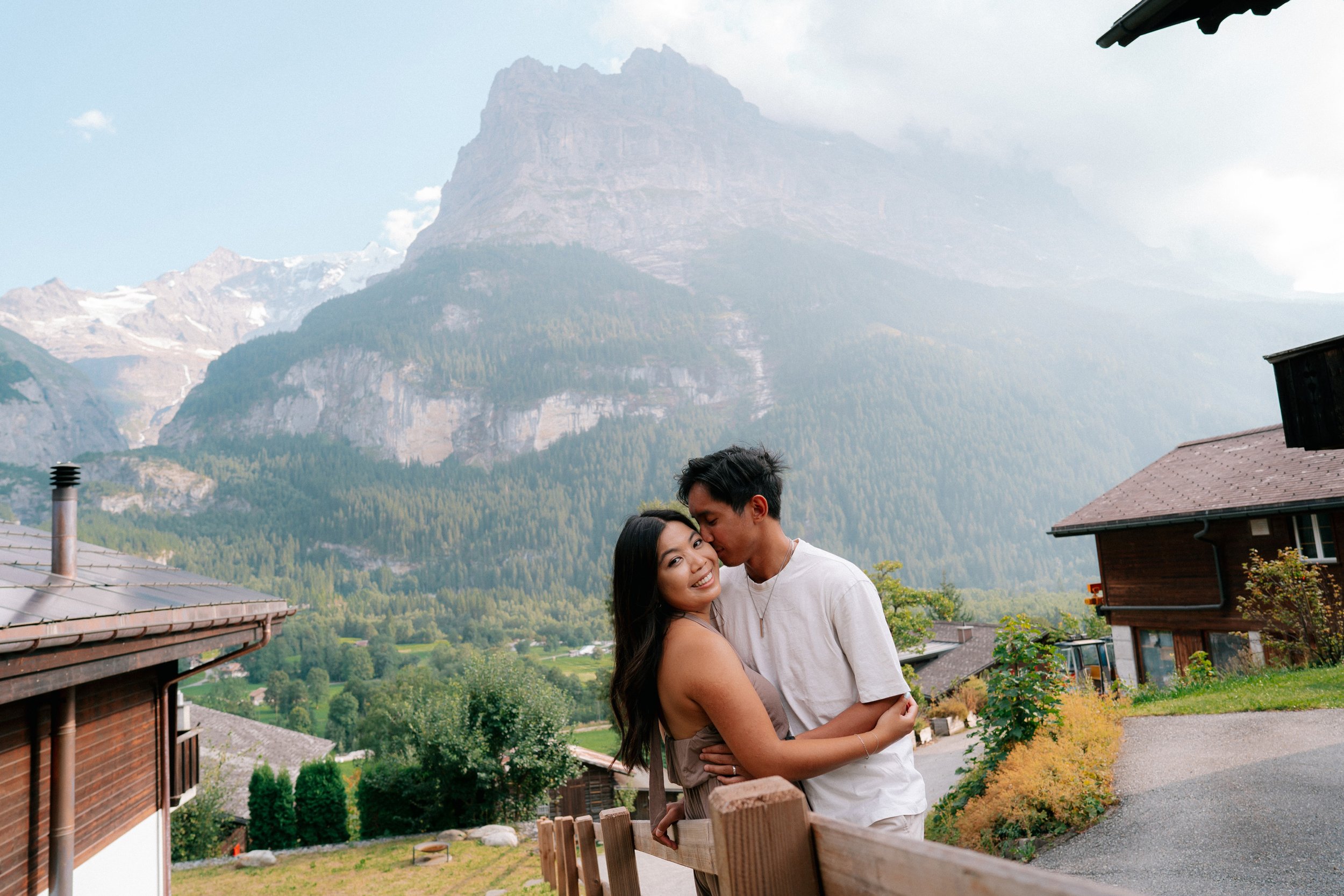 Intimate late summer couples photoshoot in Grindelwald, Switzerland featuring authentic emotions, cozy village scenery, and breathtaking alpine landscapes.