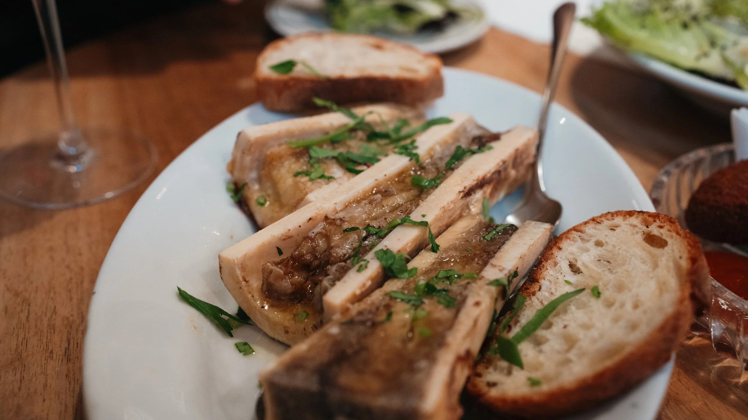 Roasted marrow bone with bread and maldon sea salt flakes in dinner restaurant Lotti in Zurich, Switzerland.